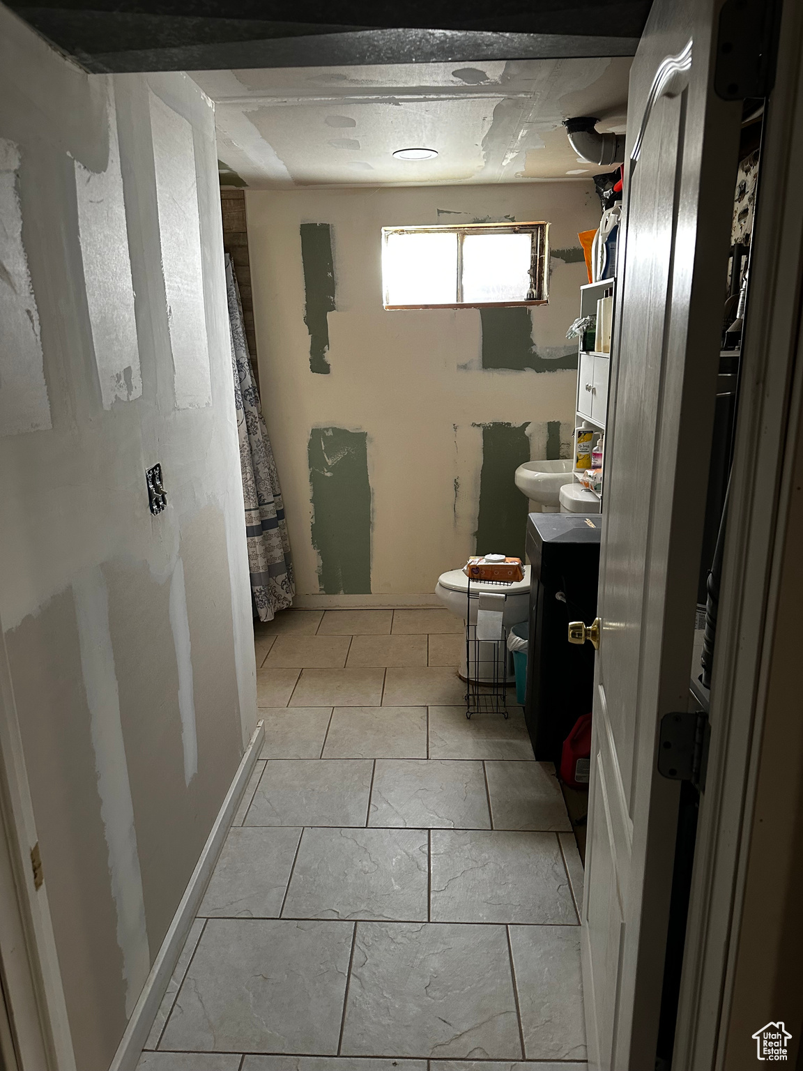 Bathroom featuring tile patterned flooring and vanity