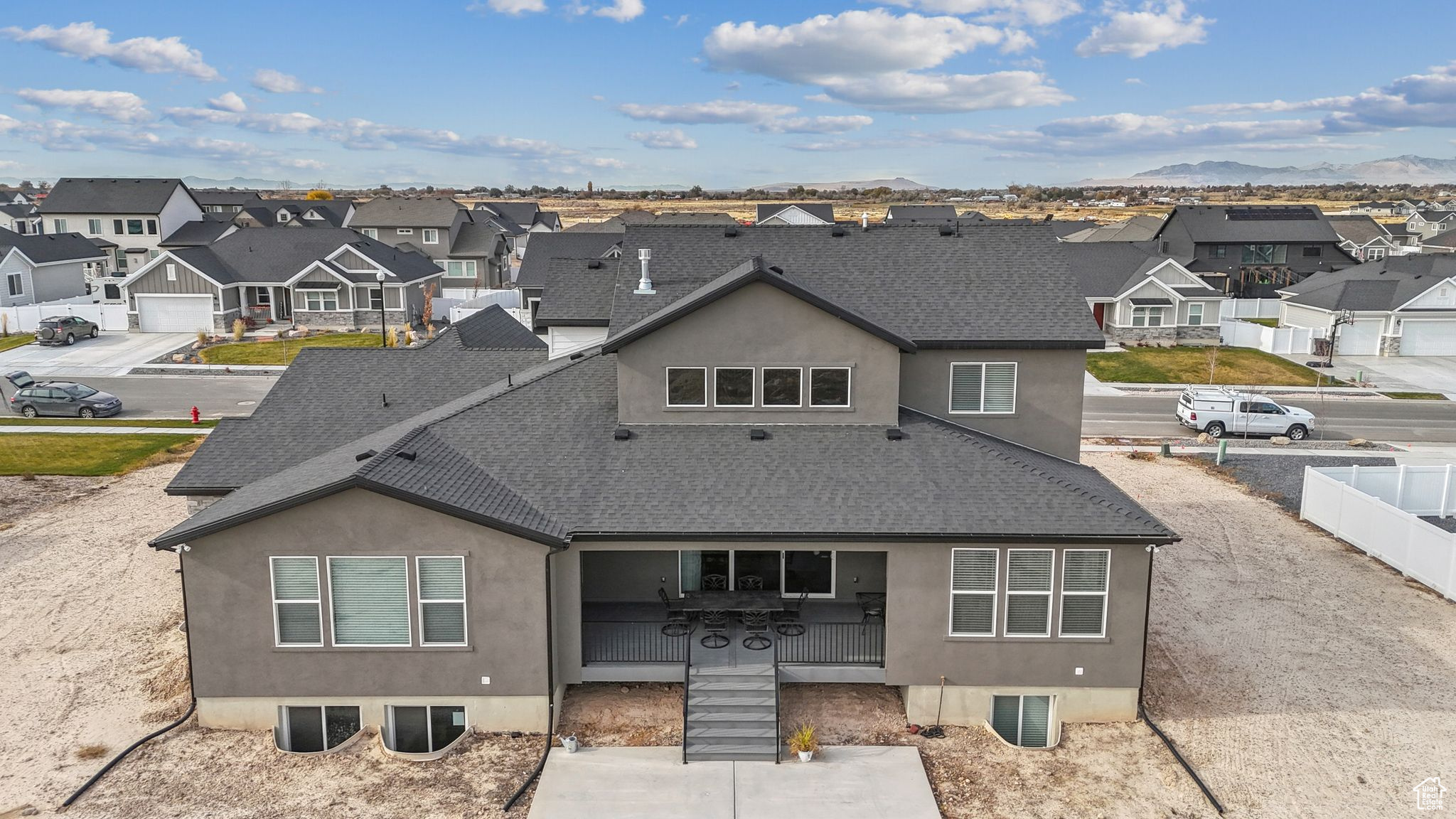 Rear view of property with a mountain view