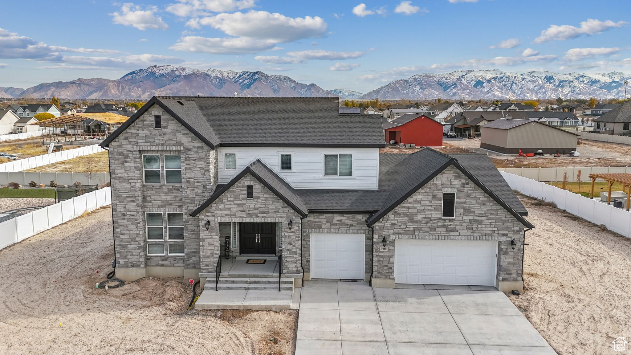 View of front facade featuring a mountain view and a garage