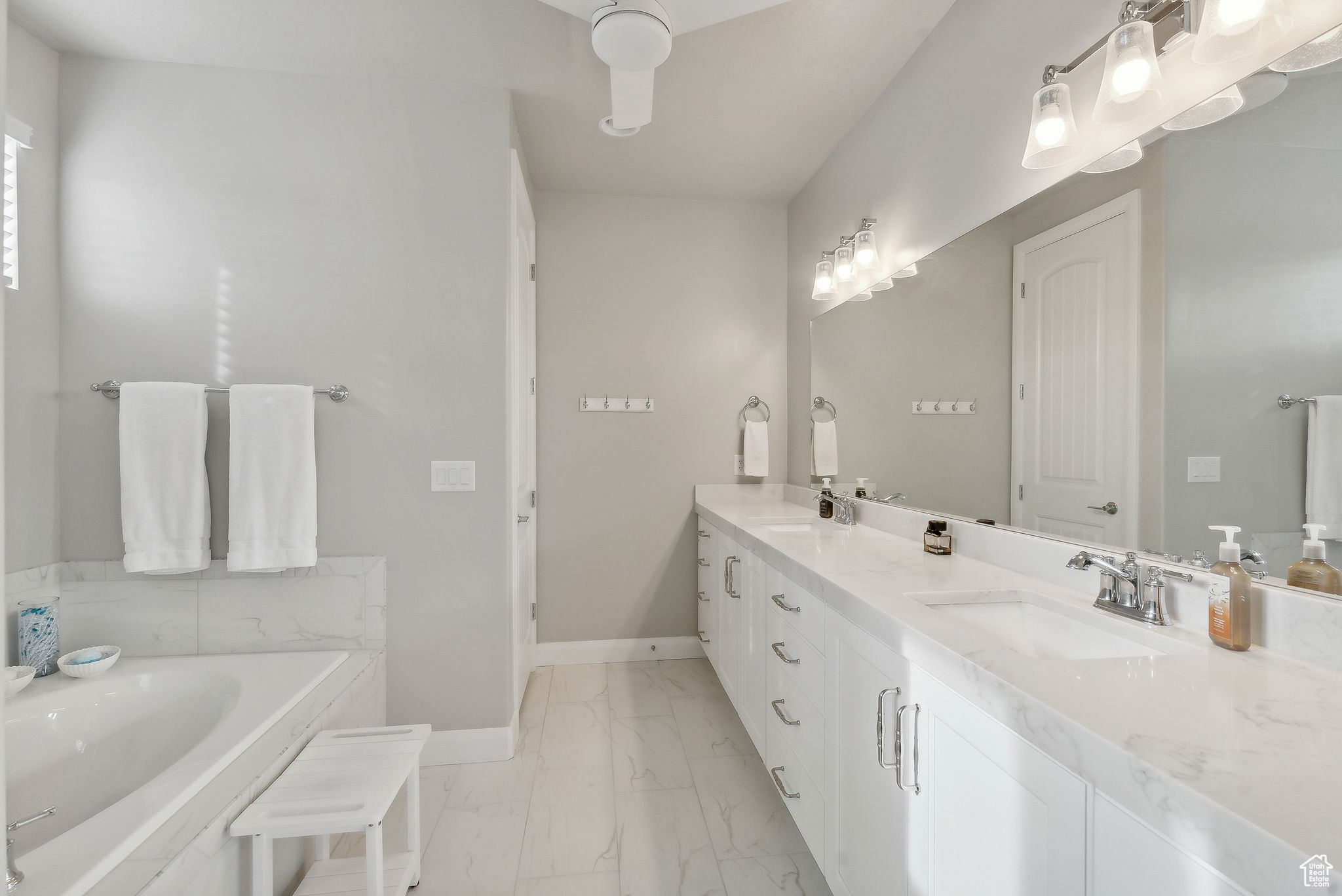 Bathroom with vanity and a tub to relax in