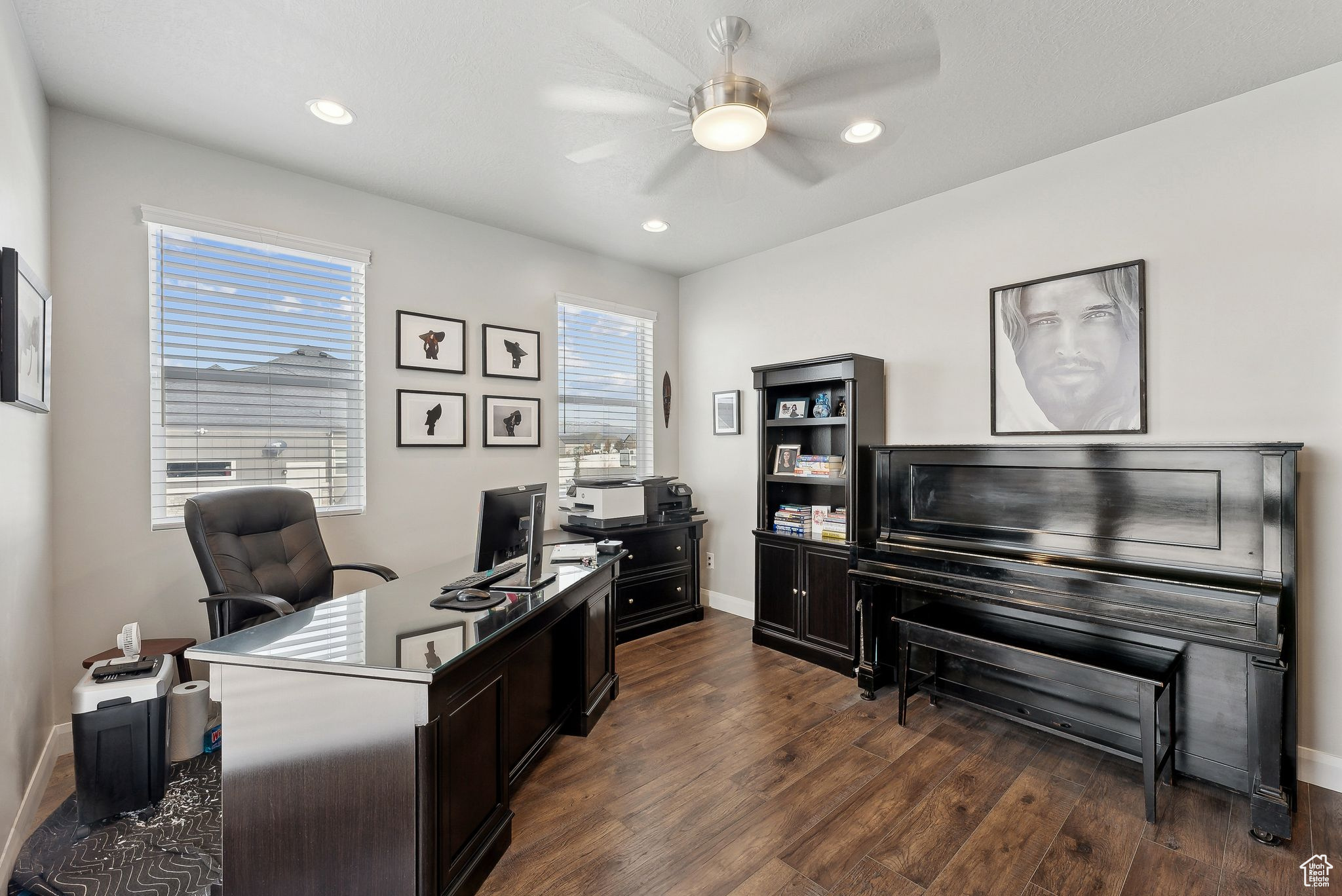 Office space featuring ceiling fan and dark hardwood / wood-style floors