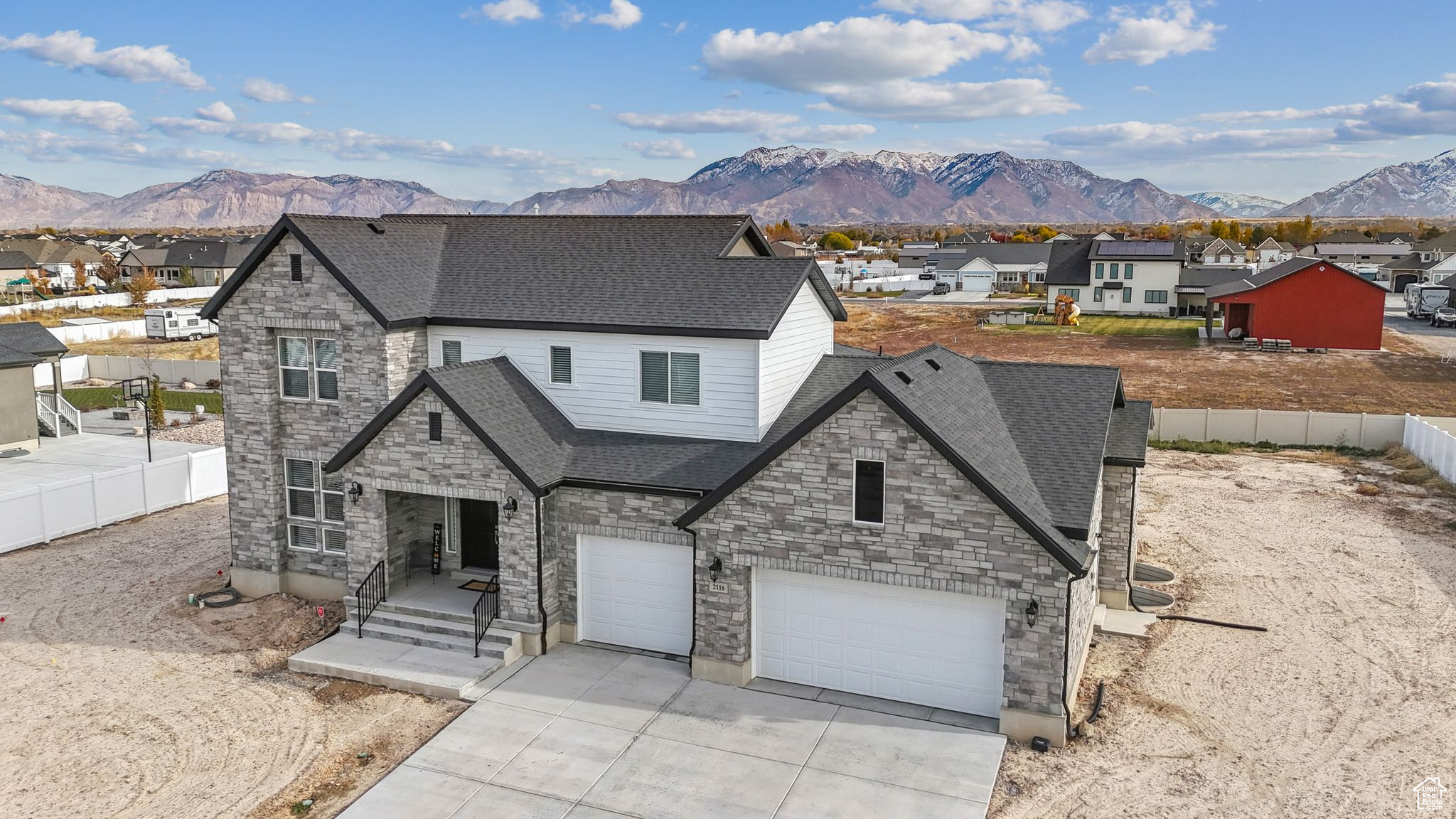 View of front facade with a mountain view and a garage