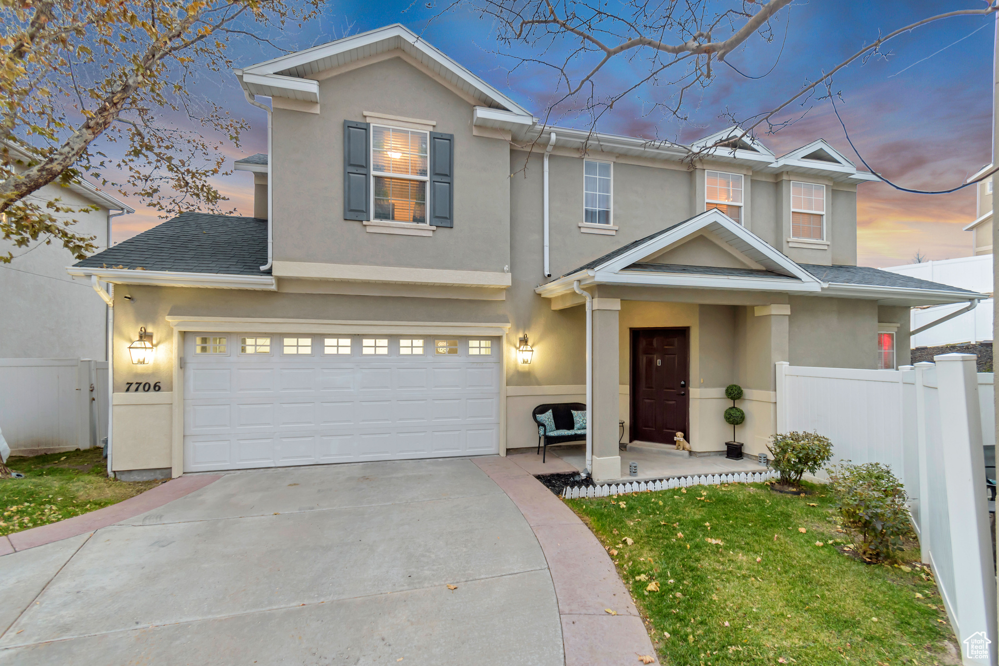 View of front facade featuring a garage