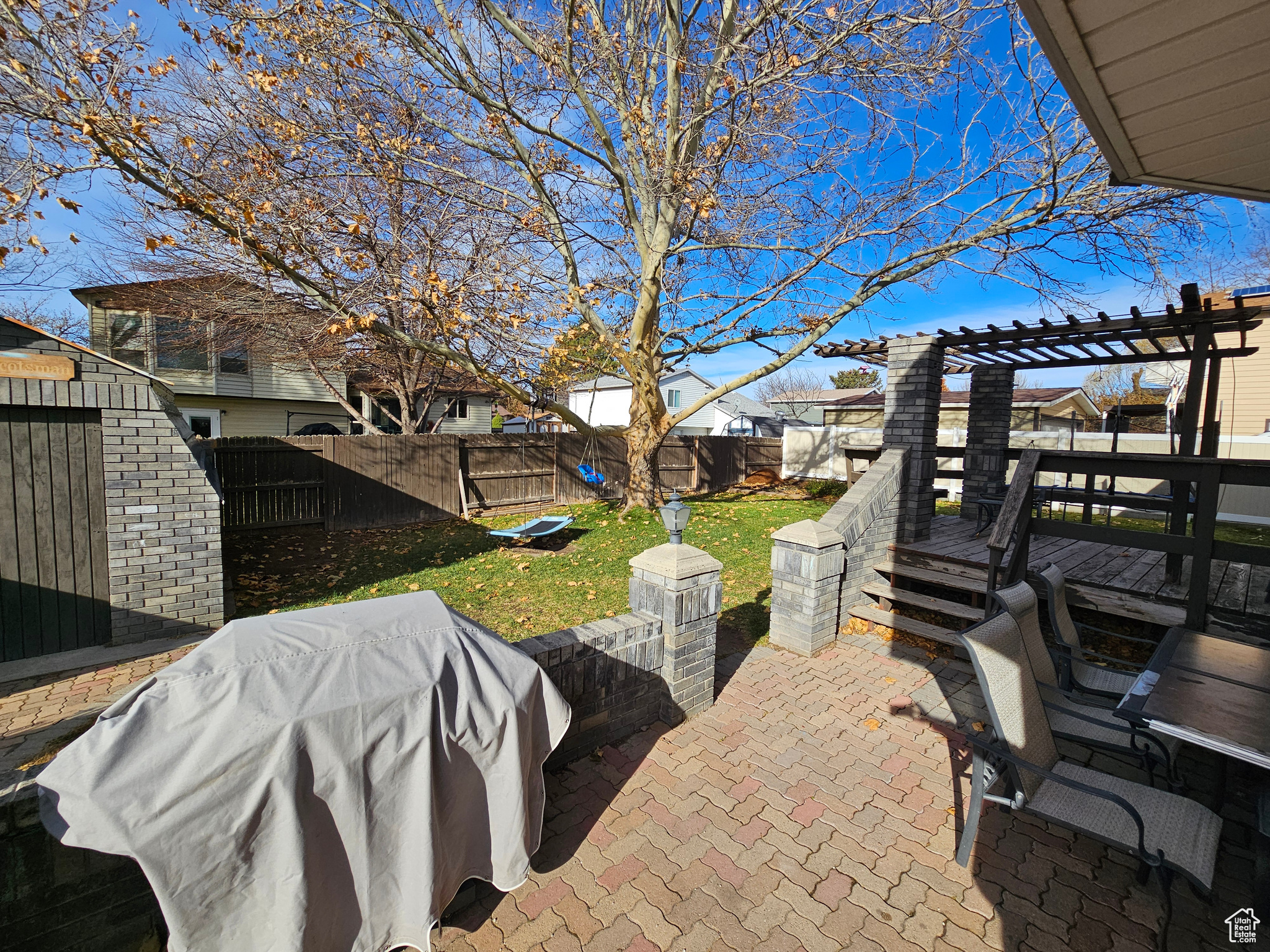 View of patio featuring a pergola and a deck