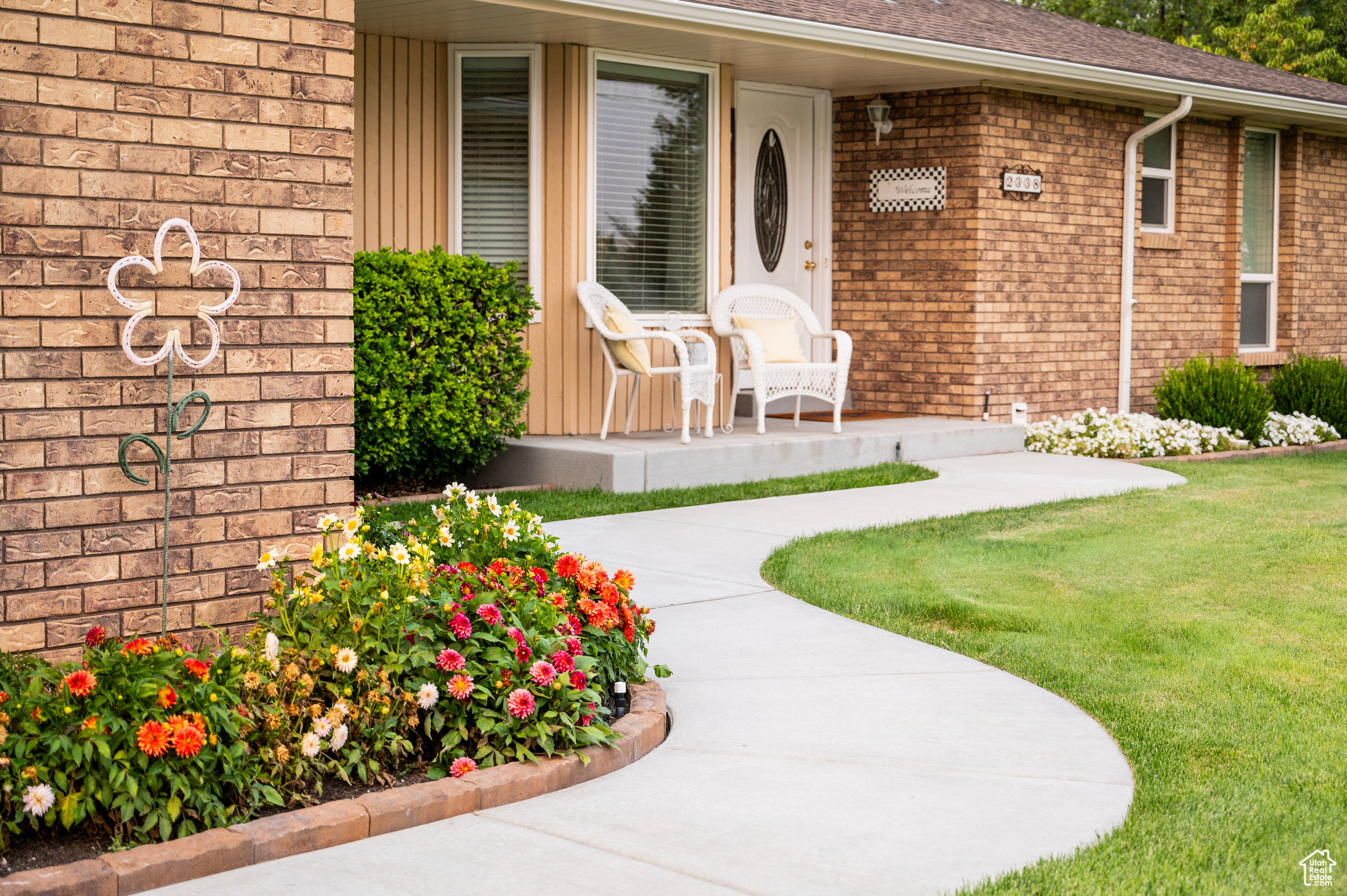 View of exterior entry featuring a yard