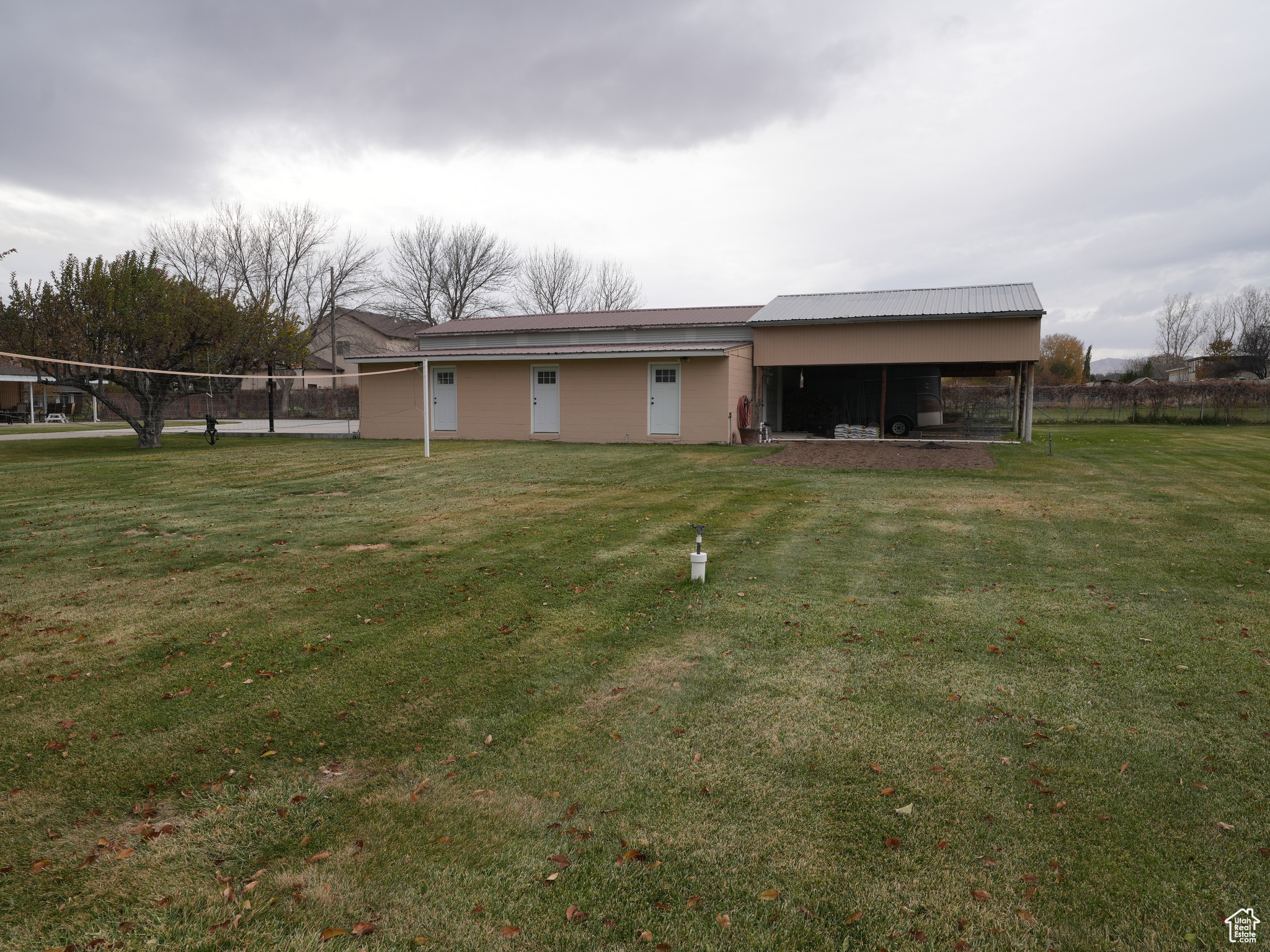 Rear view of property featuring a lawn