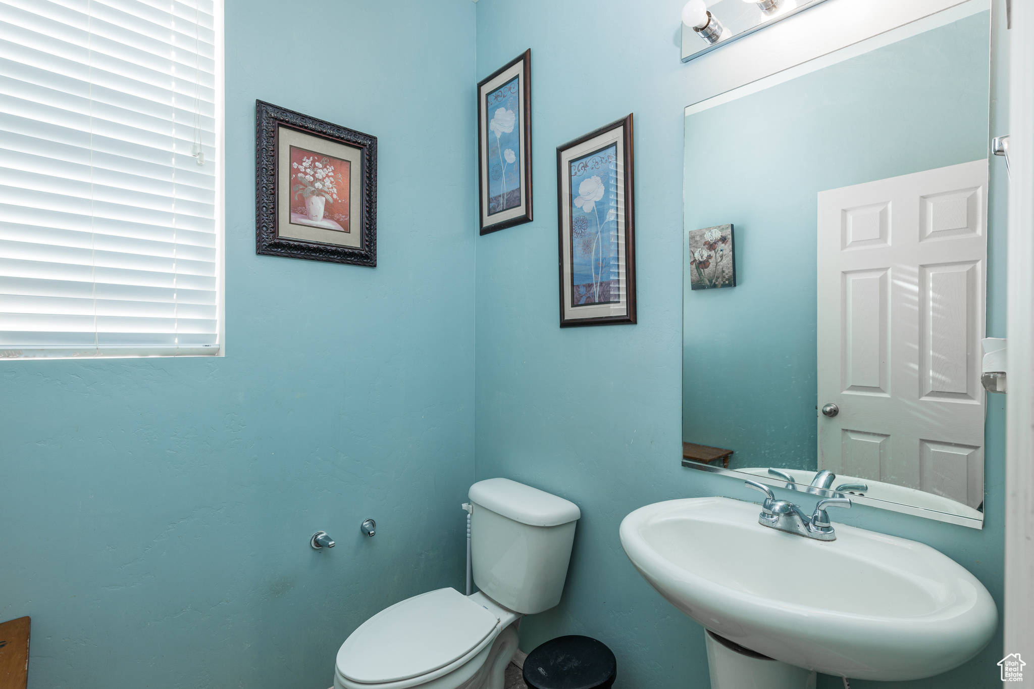 Bathroom featuring sink and toilet