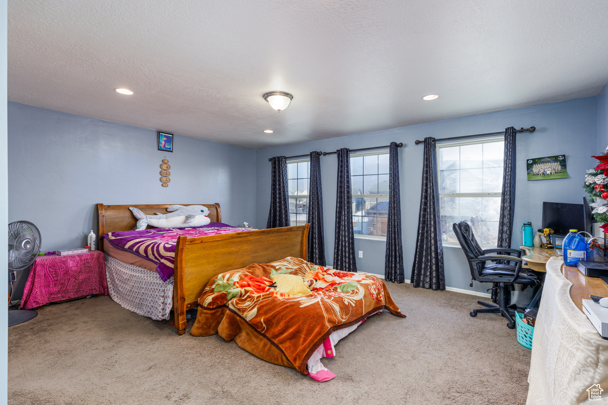 Carpeted bedroom featuring a textured ceiling