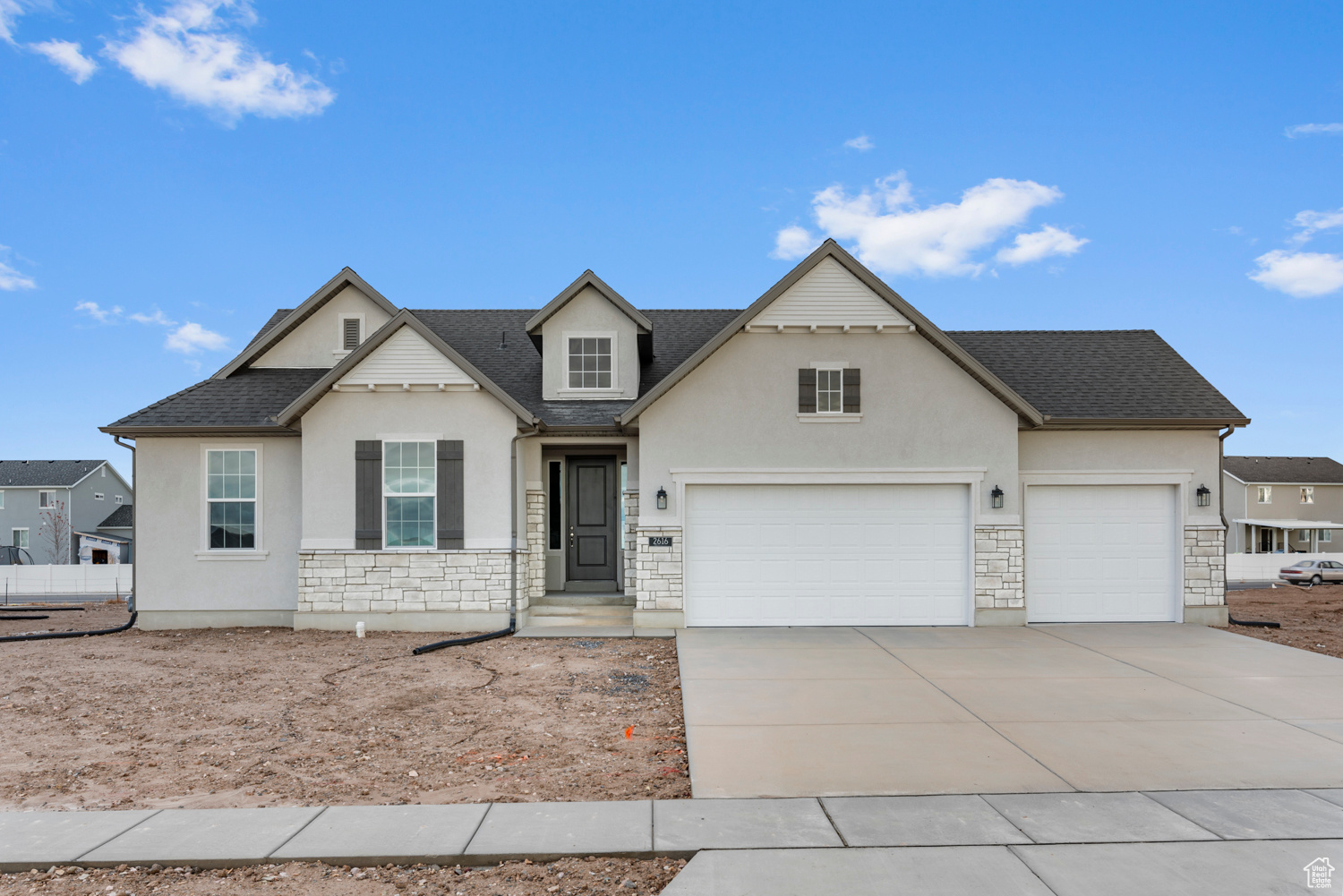 View of property with a garage