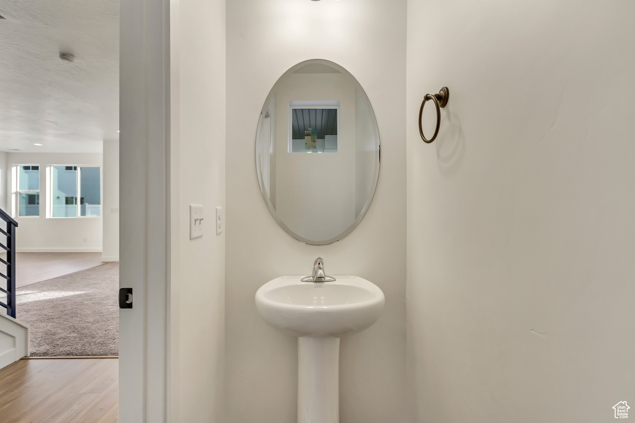 Bathroom with wood-type flooring and a textured ceiling