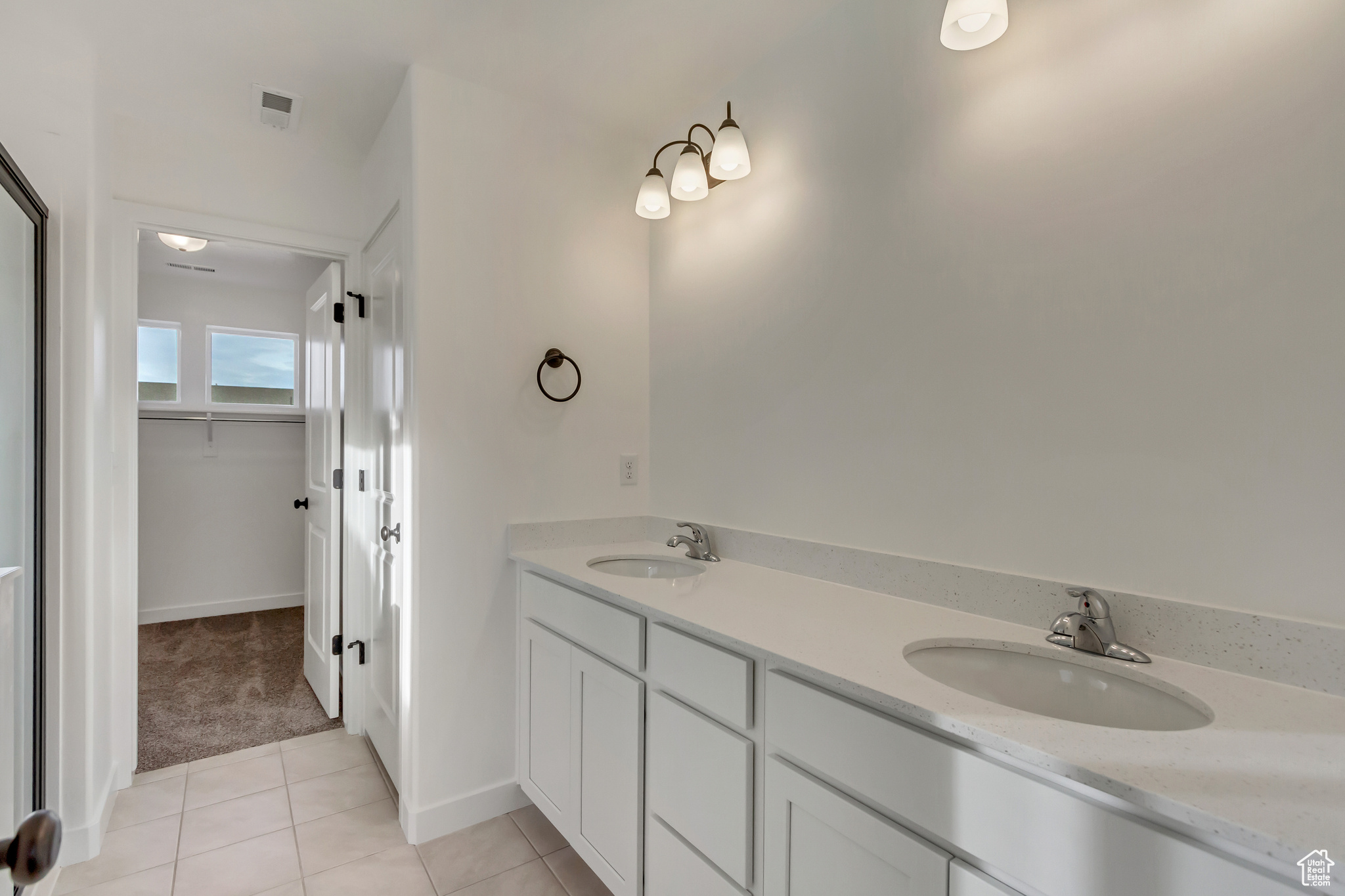 Bathroom with tile patterned flooring and vanity