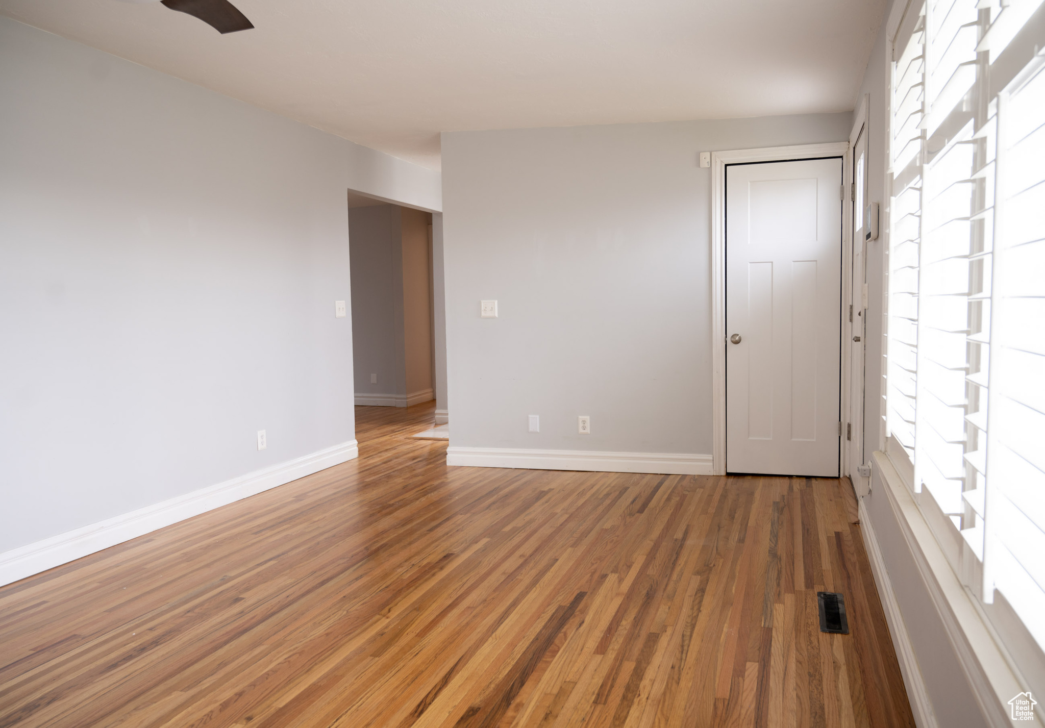 Empty room featuring hardwood / wood-style flooring