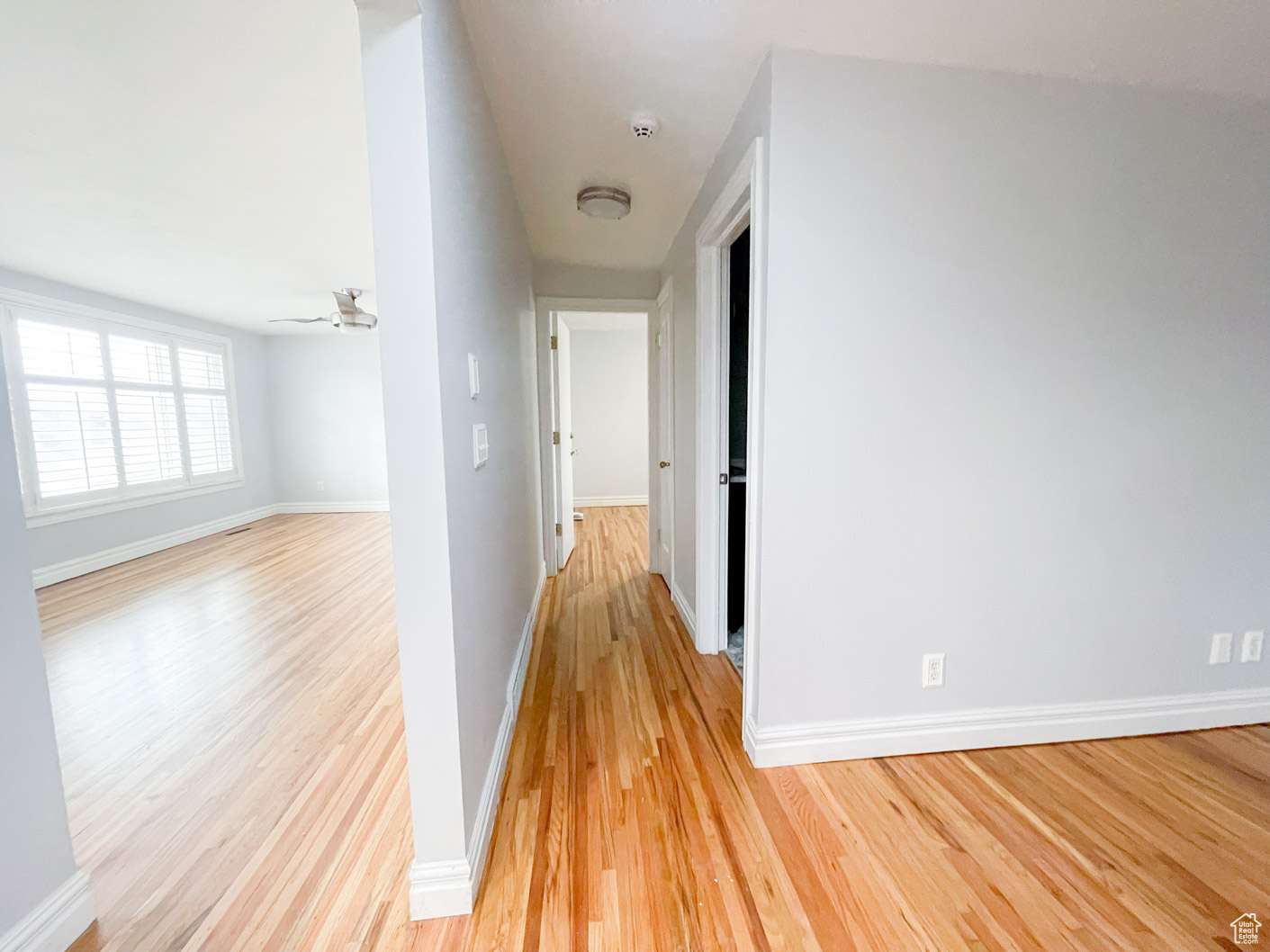 Corridor with light wood-type flooring