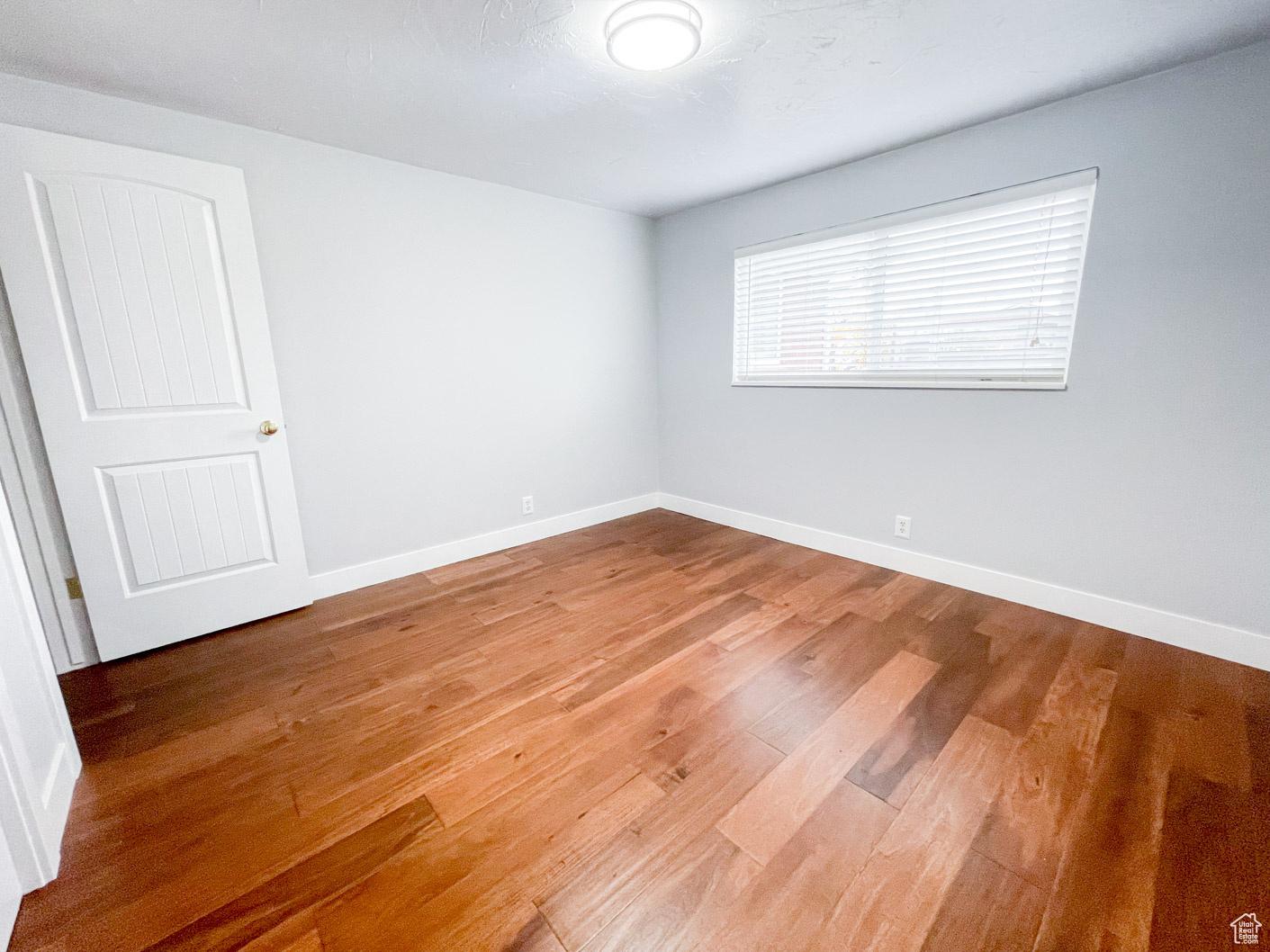 Empty room with wood-type flooring