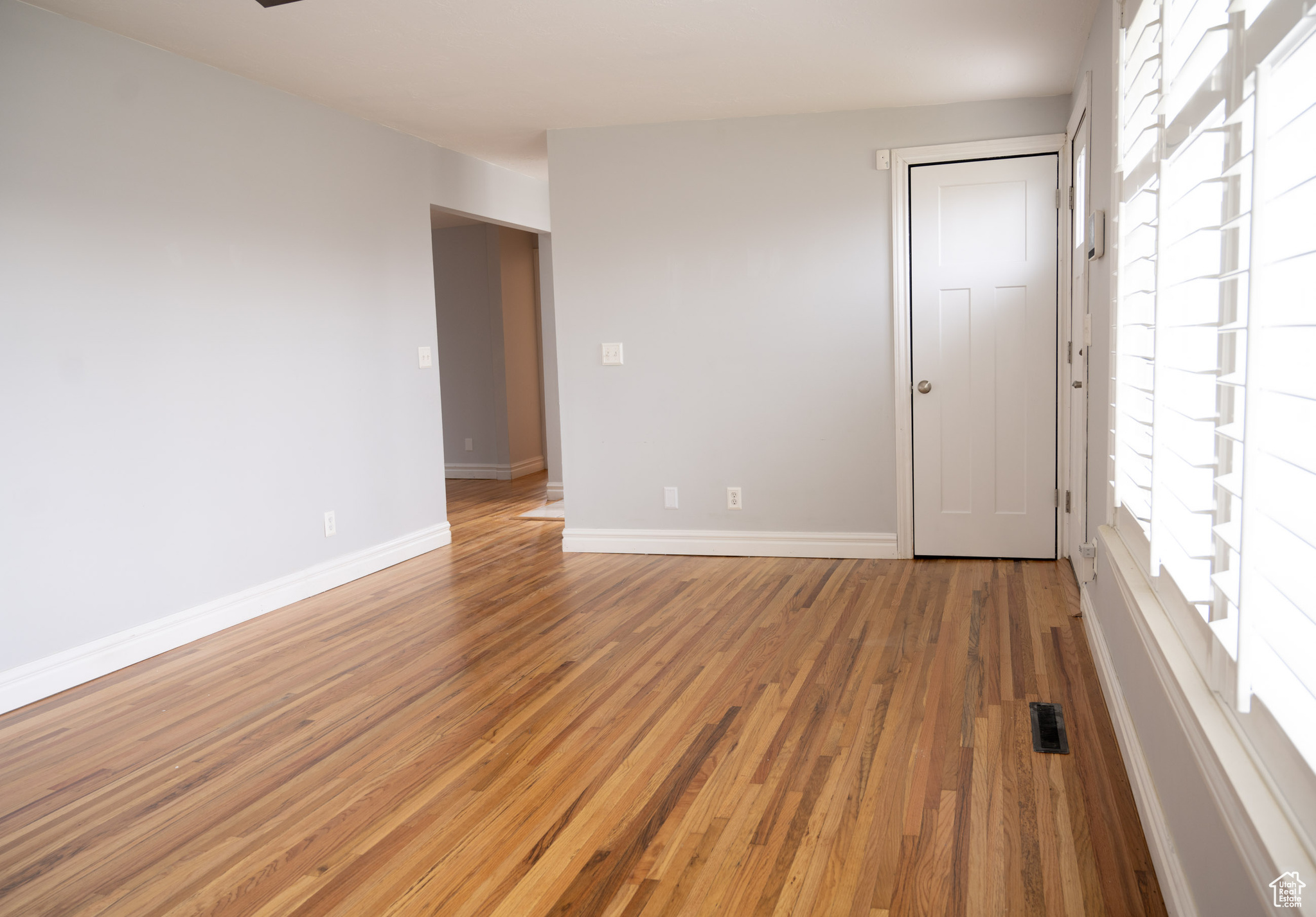 Empty room featuring hardwood / wood-style flooring