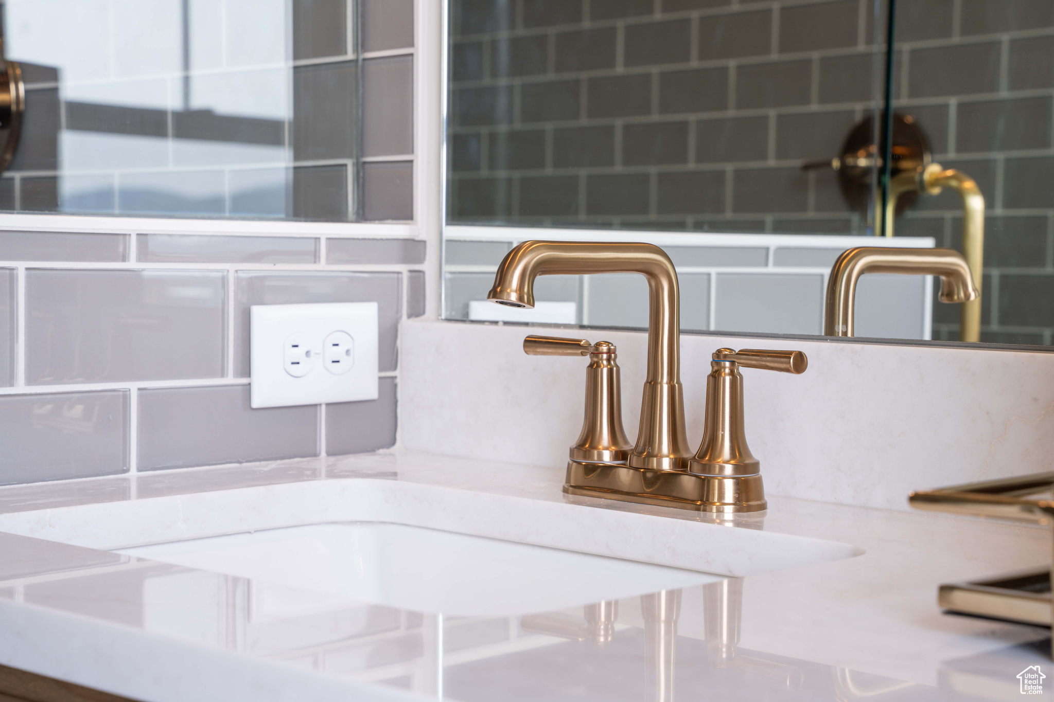 Room details with tasteful backsplash and sink