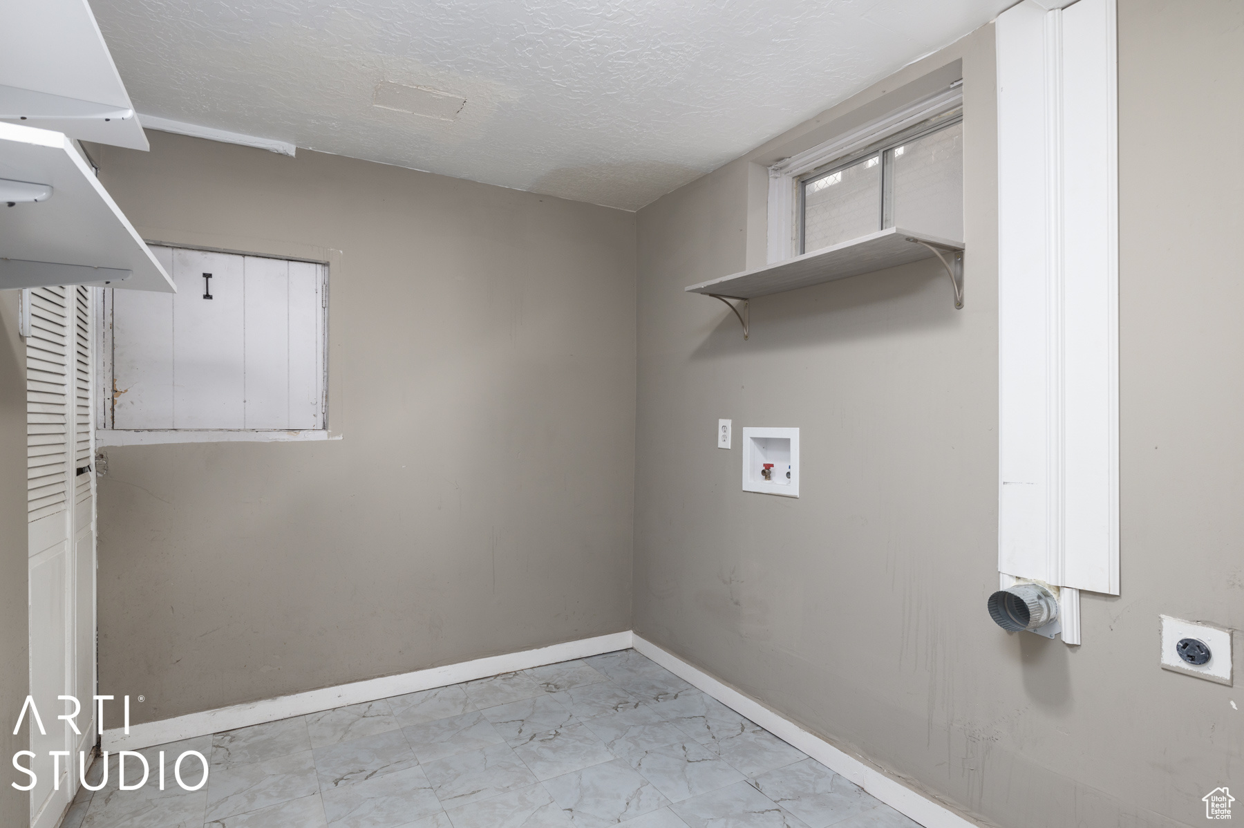 Washroom featuring washer hookup and hookup for an electric dryer