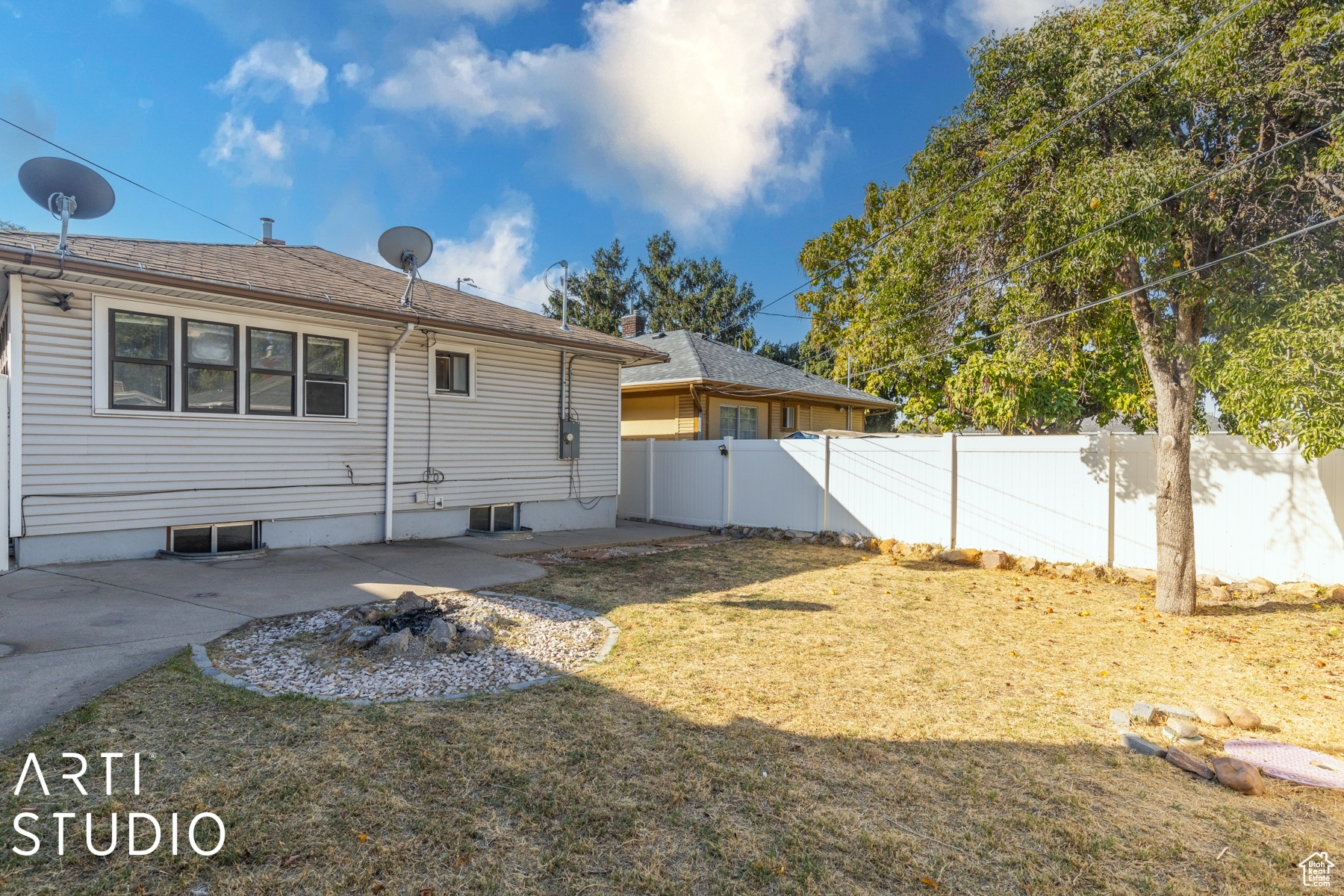 Rear view of house featuring a patio area and a yard