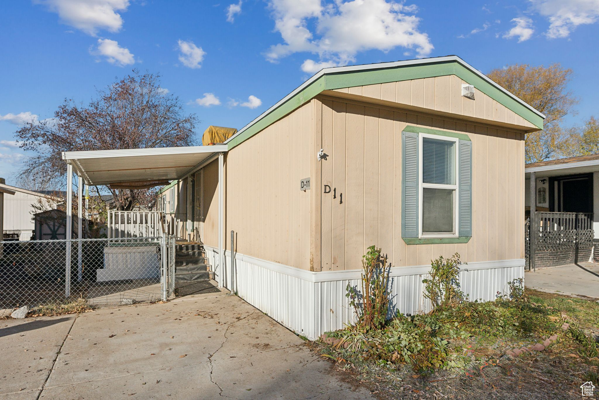 View of side of home featuring a porch