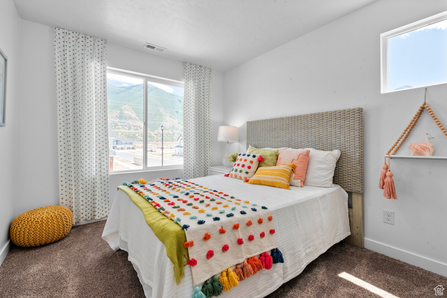 Bedroom with dark colored carpet