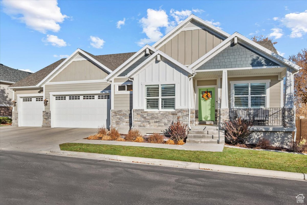 Craftsman-style home featuring a garage