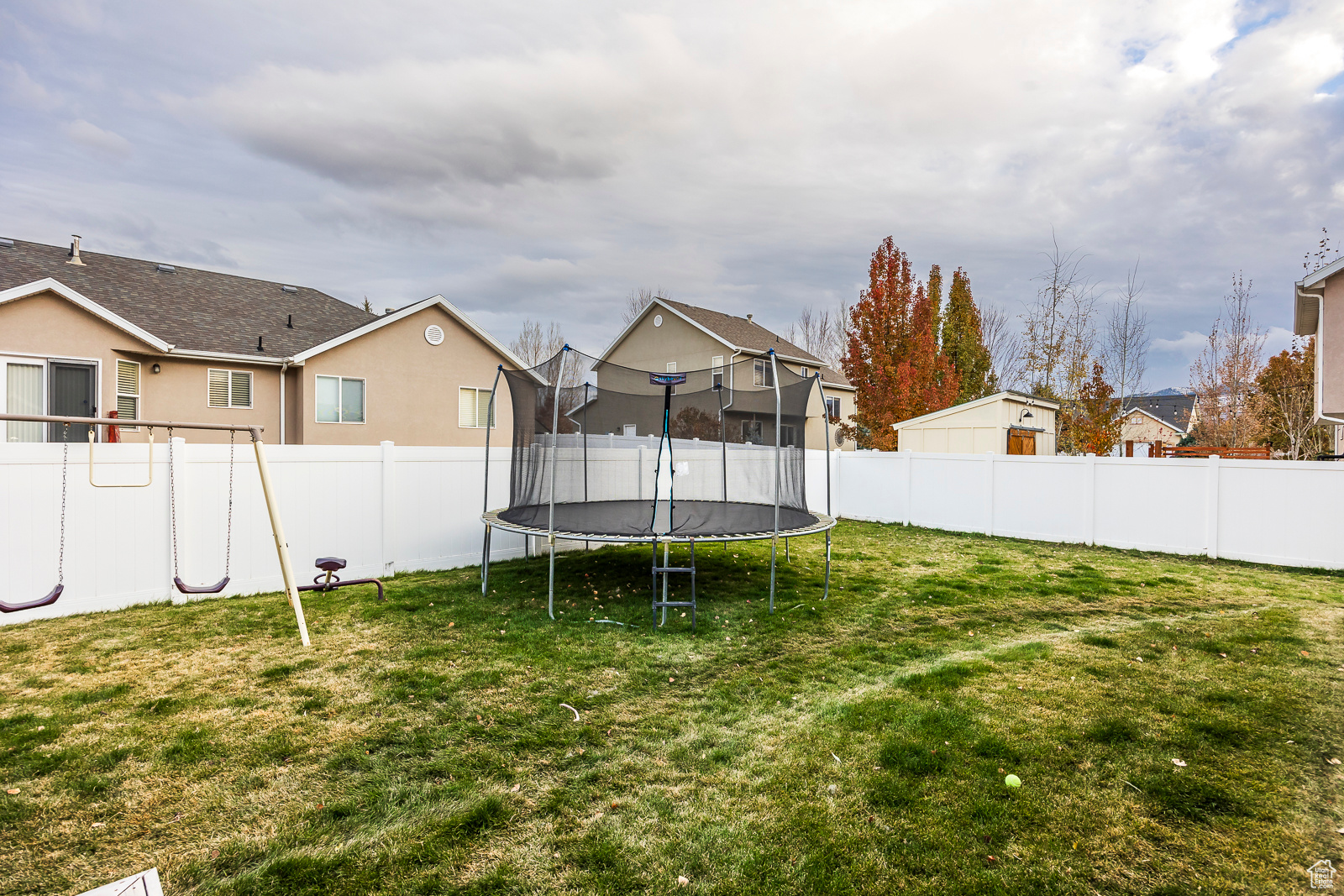 View of yard featuring a trampoline