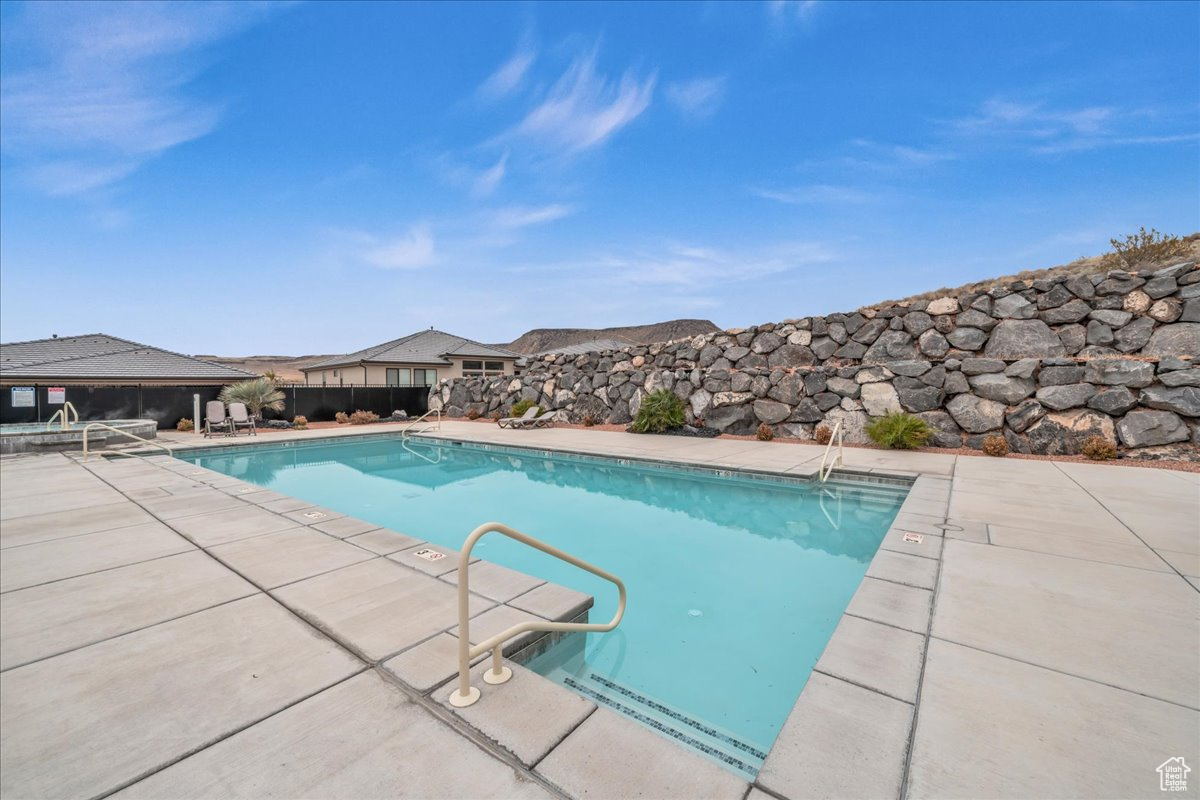 View of swimming pool with a patio area