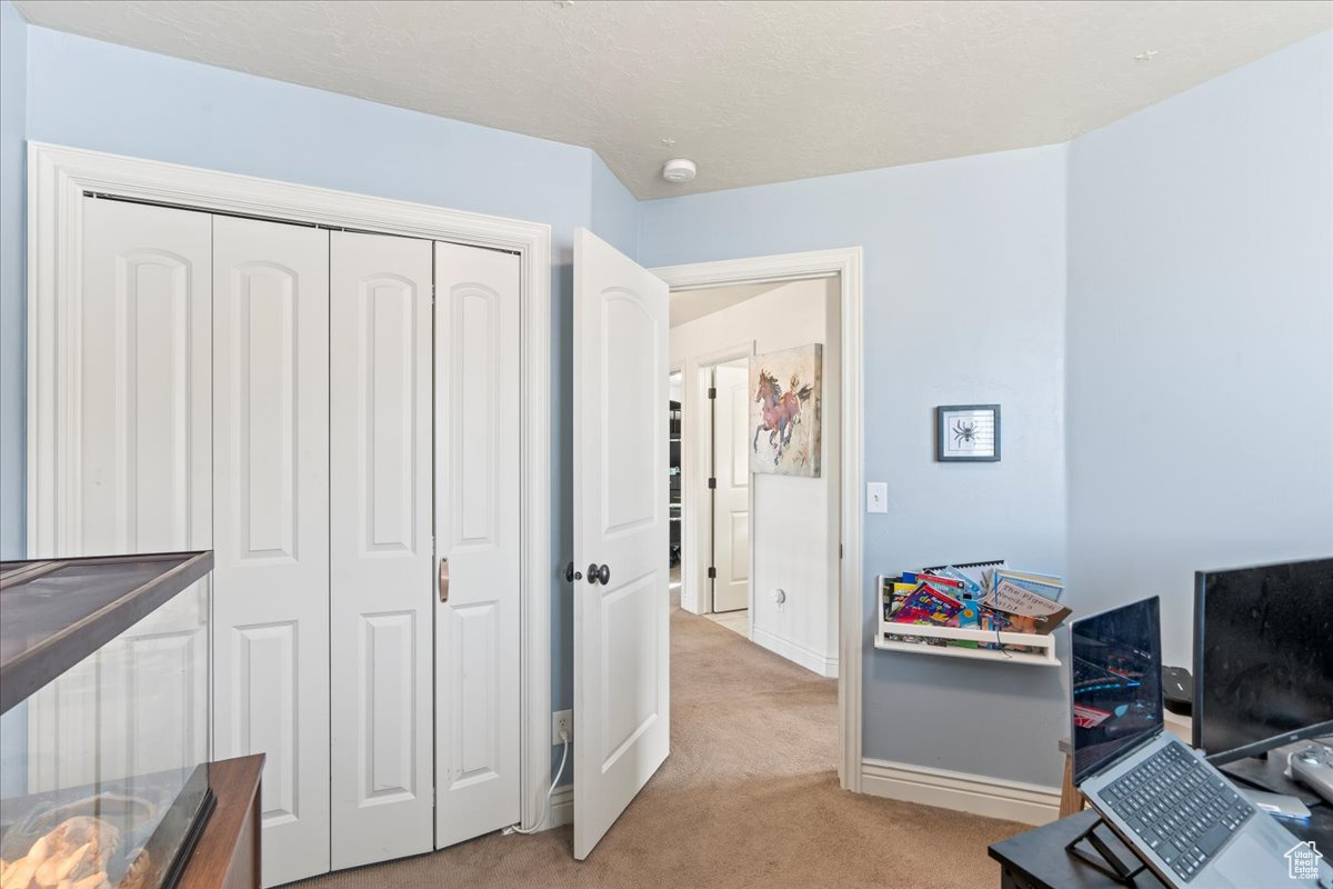 View of carpeted home office