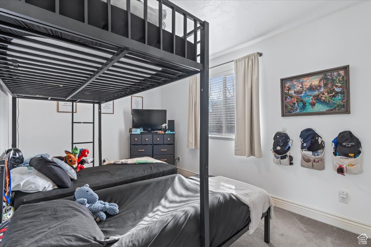 Bedroom featuring carpet floors