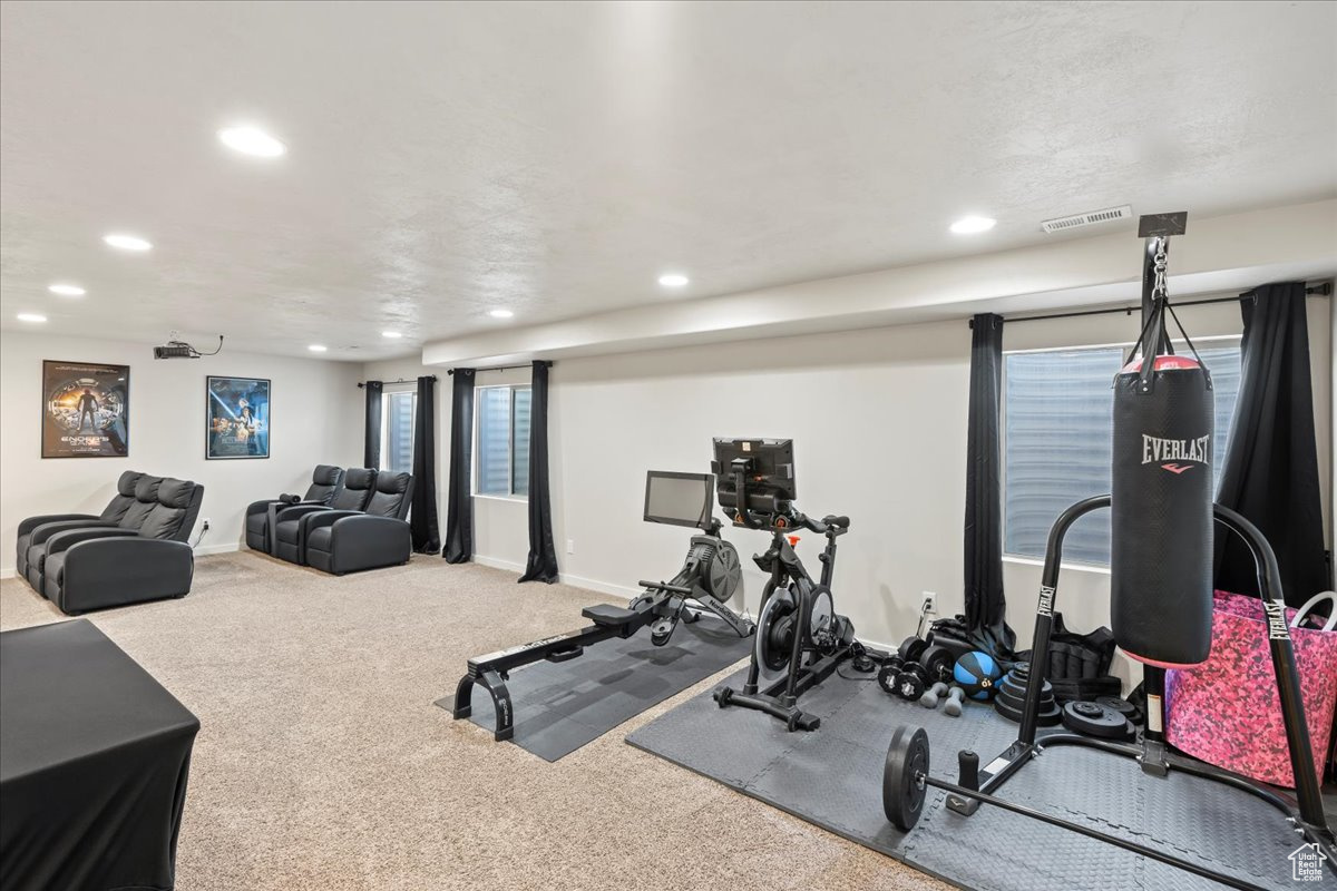 Workout room featuring carpet floors