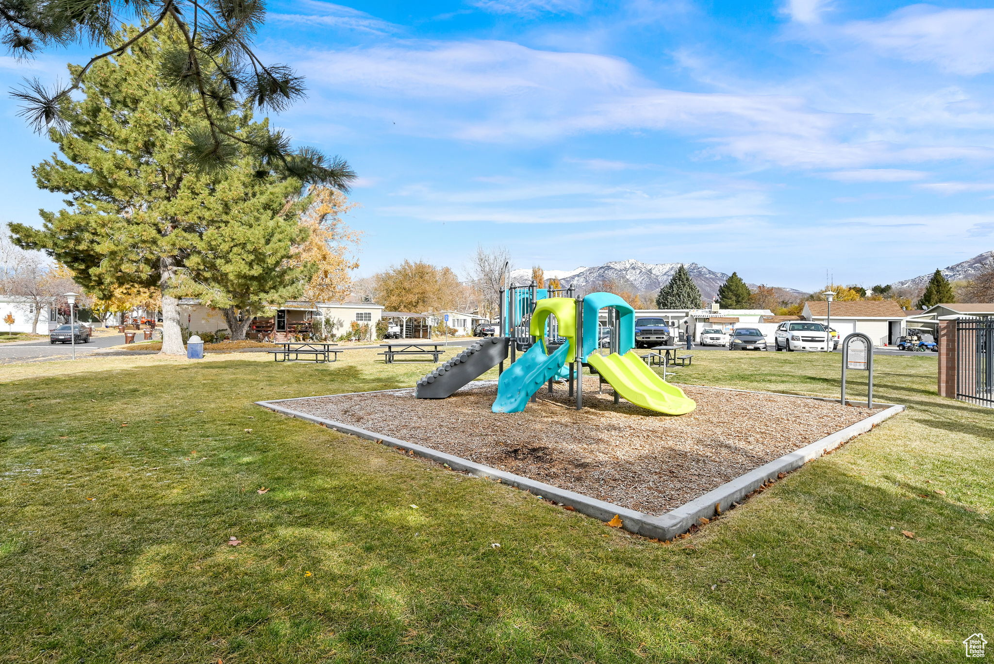 View of play area featuring a lawn and a mountain view