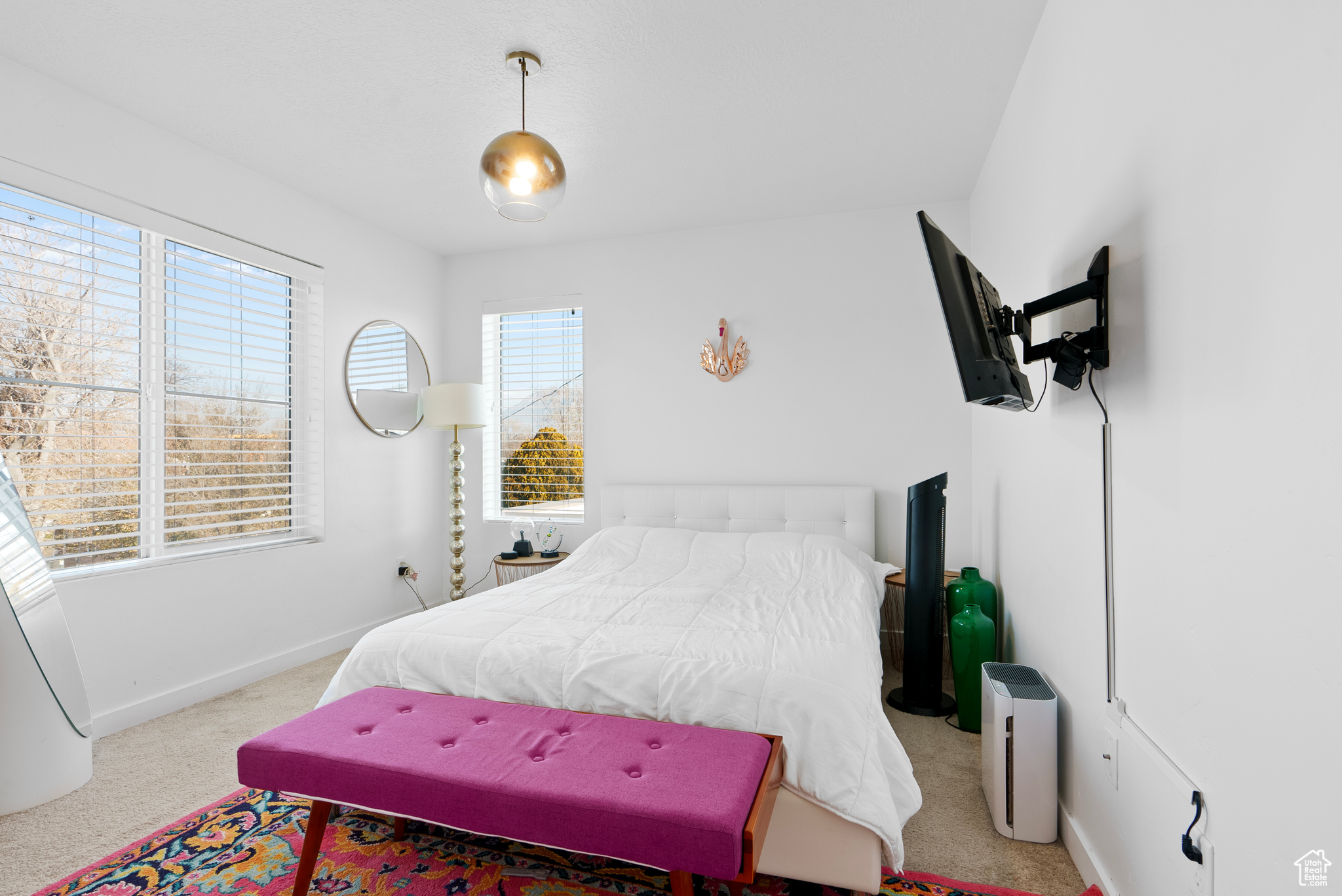 Bedroom with light carpet