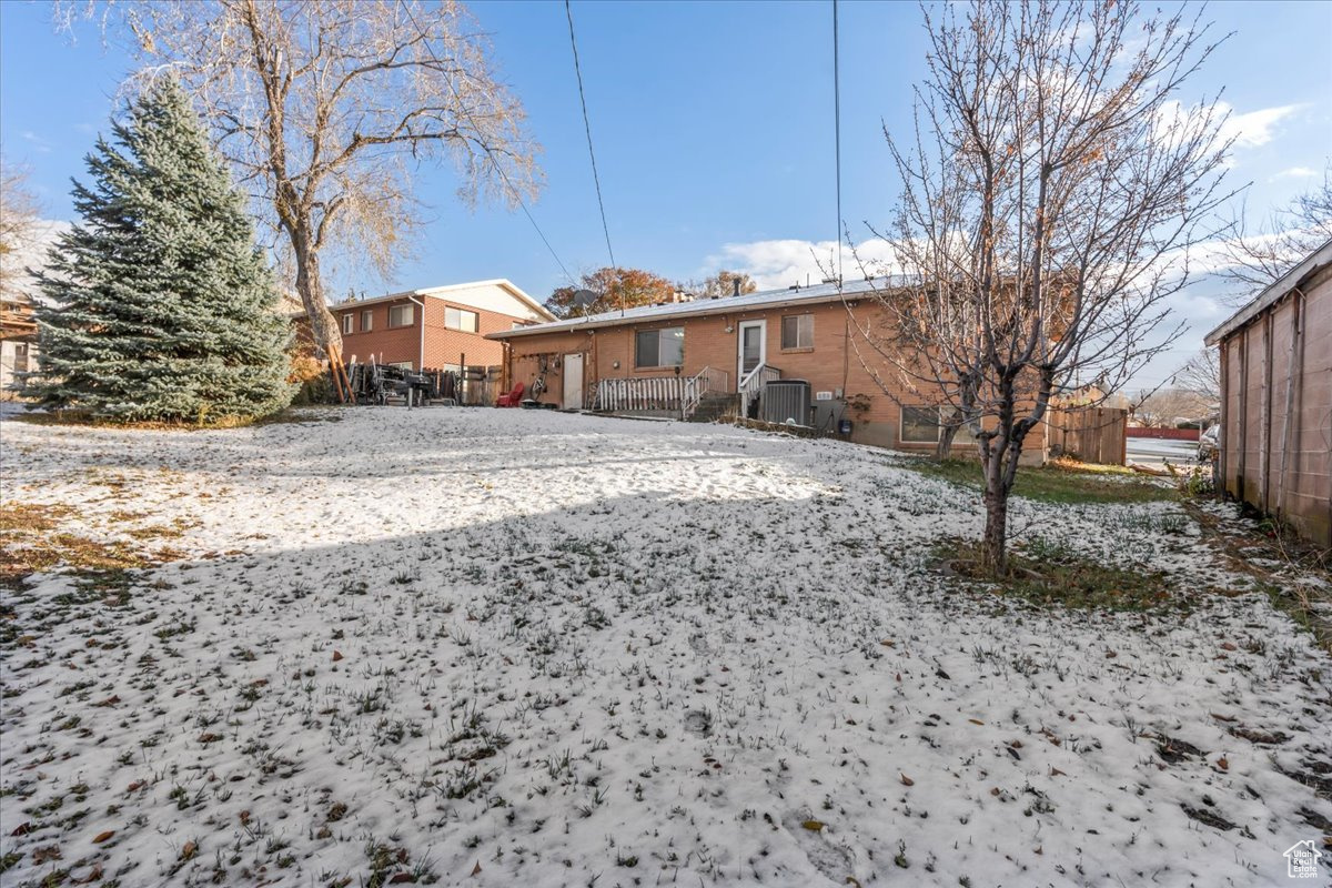 View of yard covered in snow