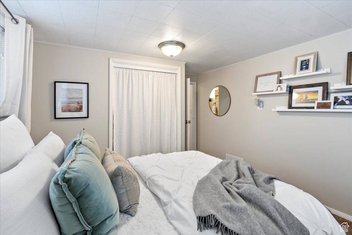 Bedroom featuring ornamental molding