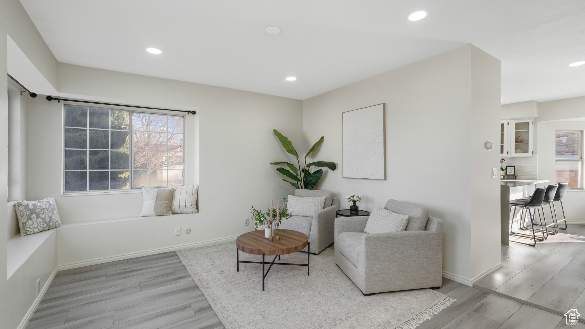 Sitting room with light hardwood / wood-style flooring