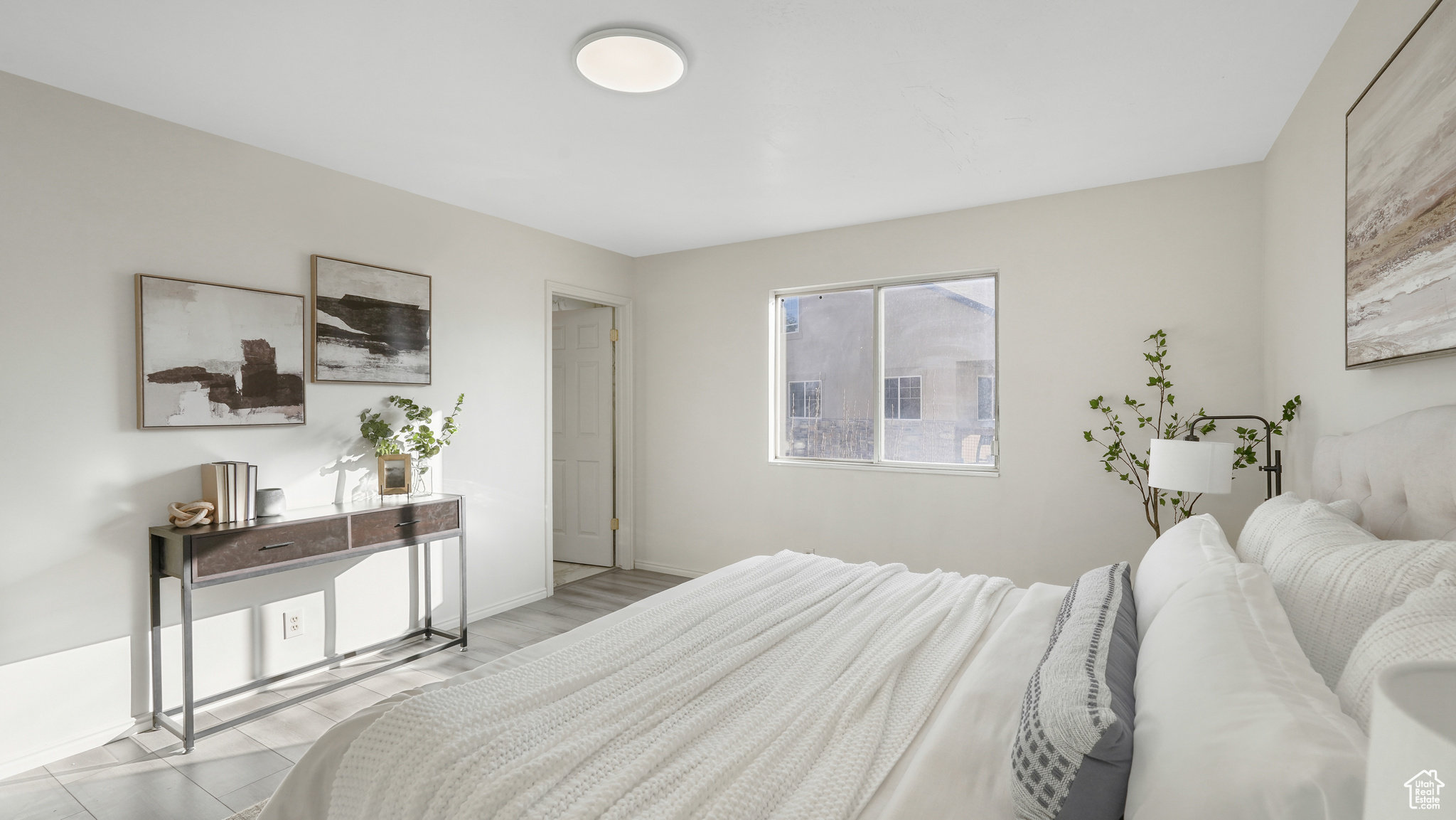 Primary Bedroom with light tile patterned floors