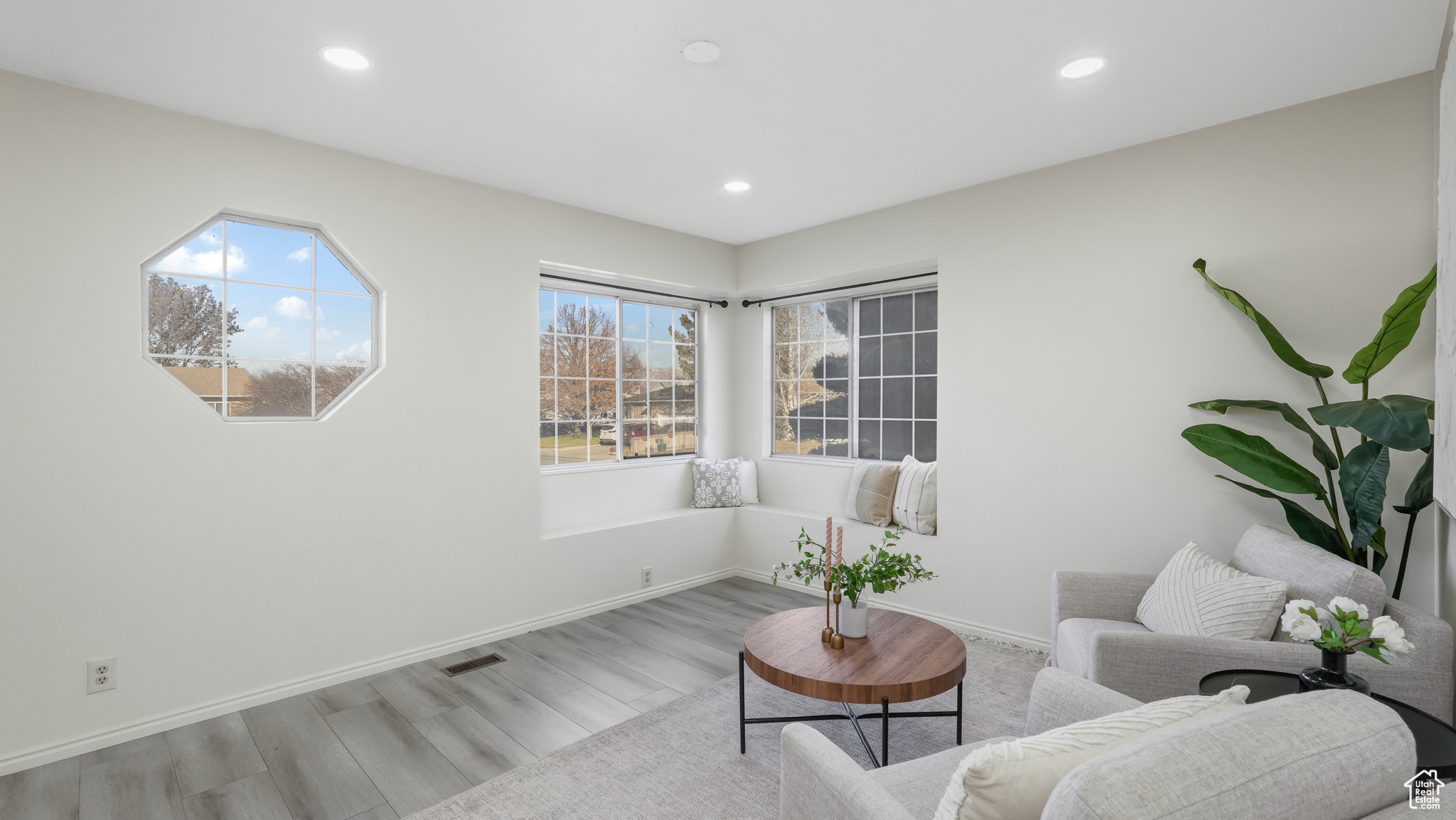 Living area with light wood-type flooring