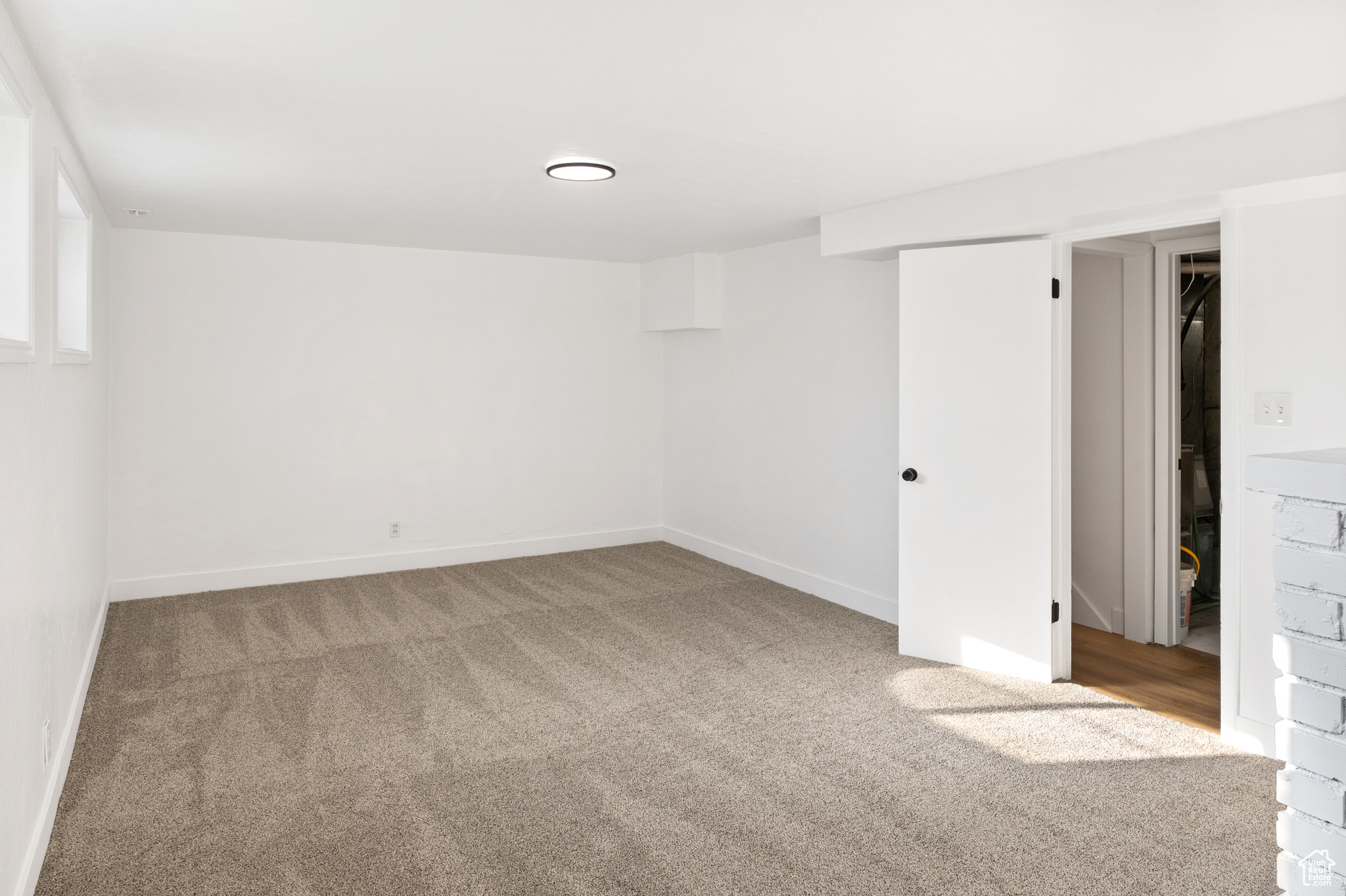 Unfurnished room with carpet flooring