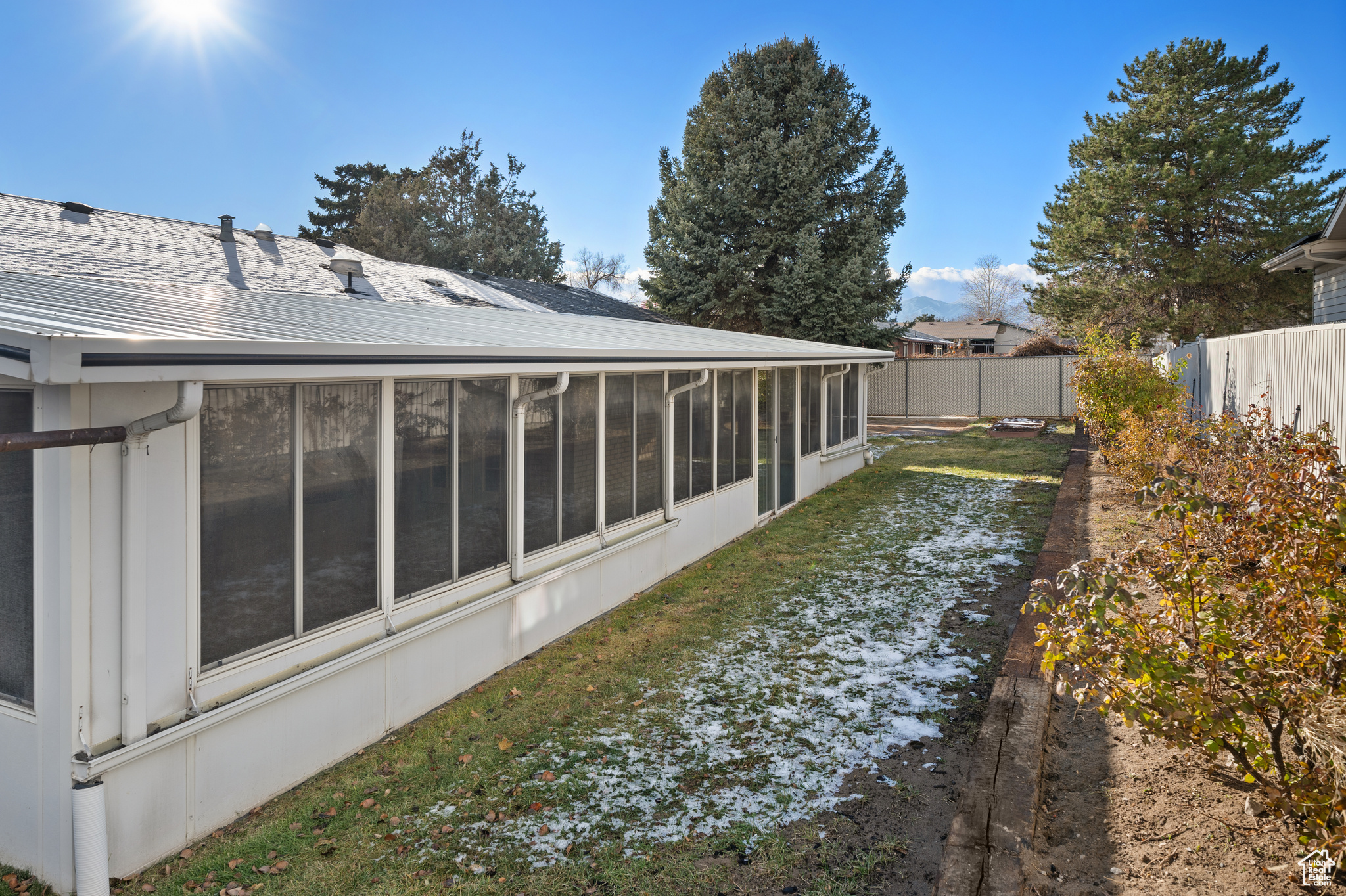 View of yard featuring a sunroom