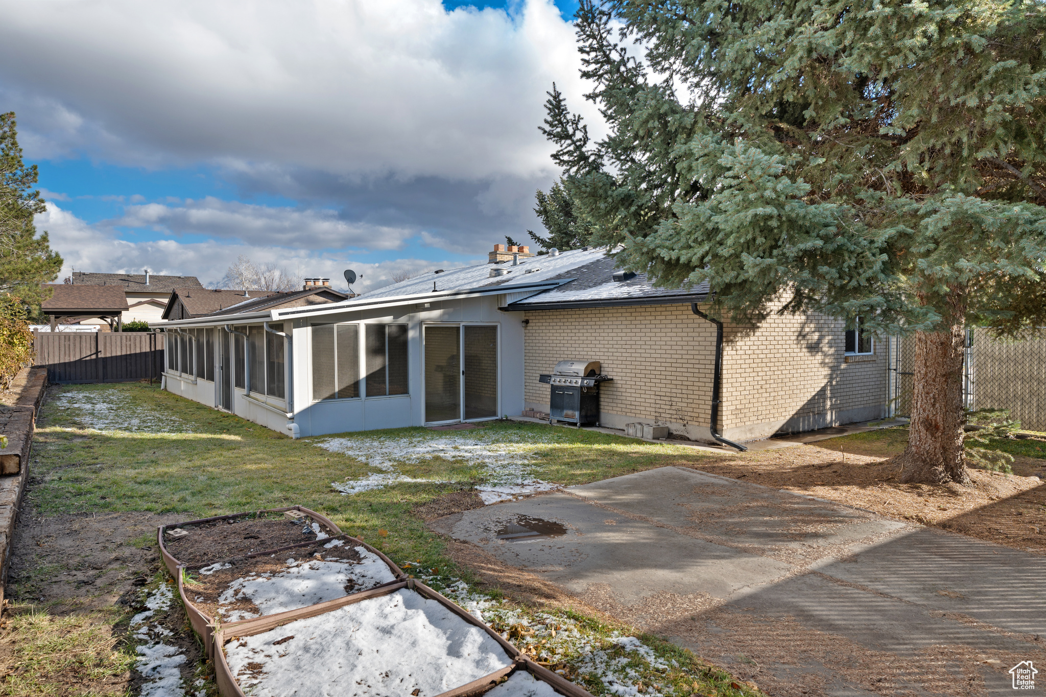 Rear view of house with a lawn