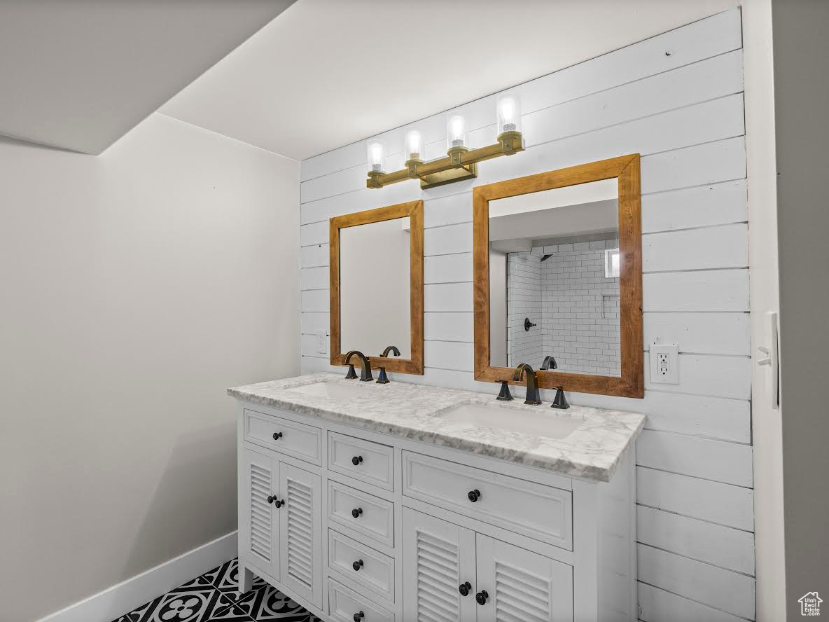 Bathroom with wooden walls and vanity