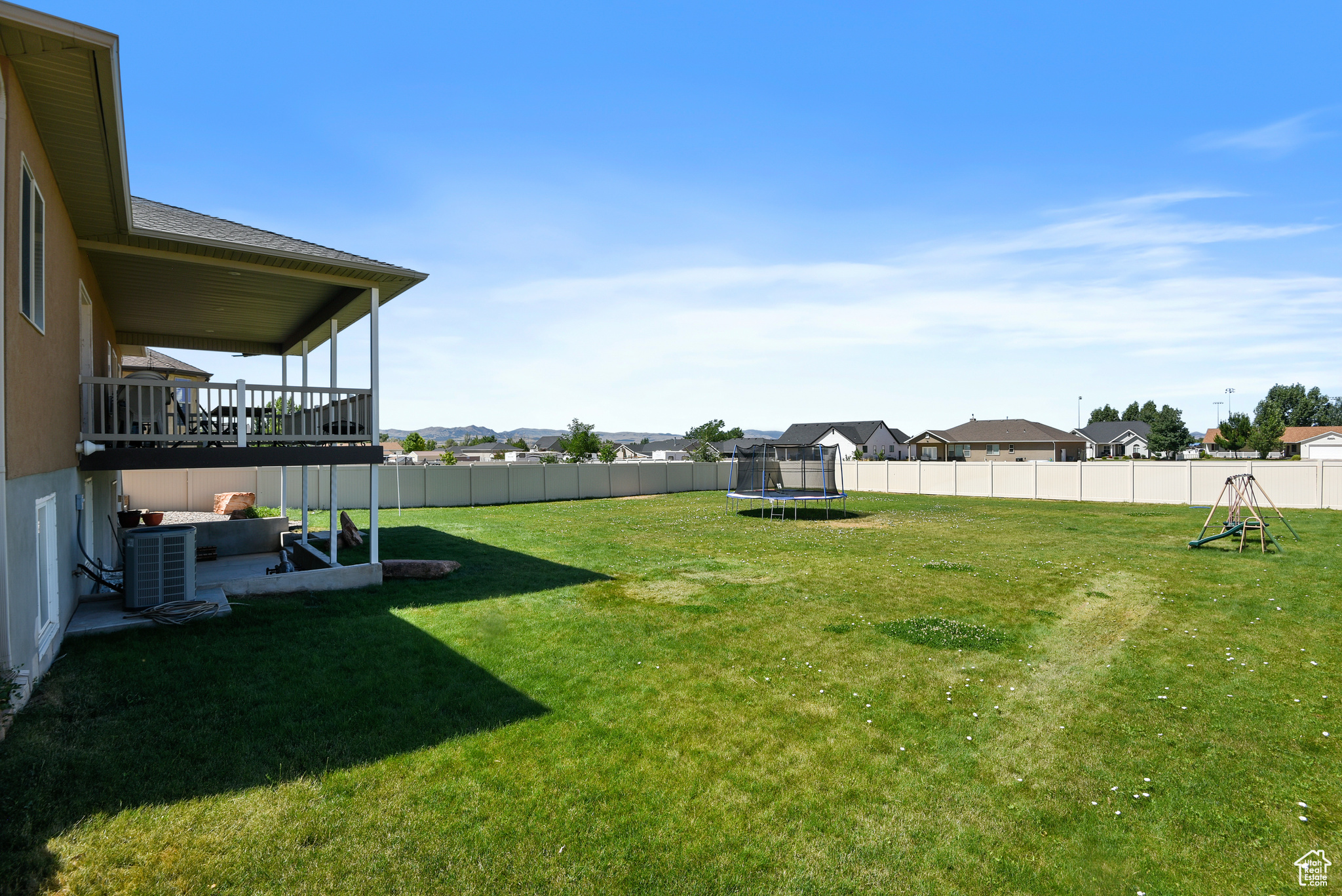 View of yard with a trampoline