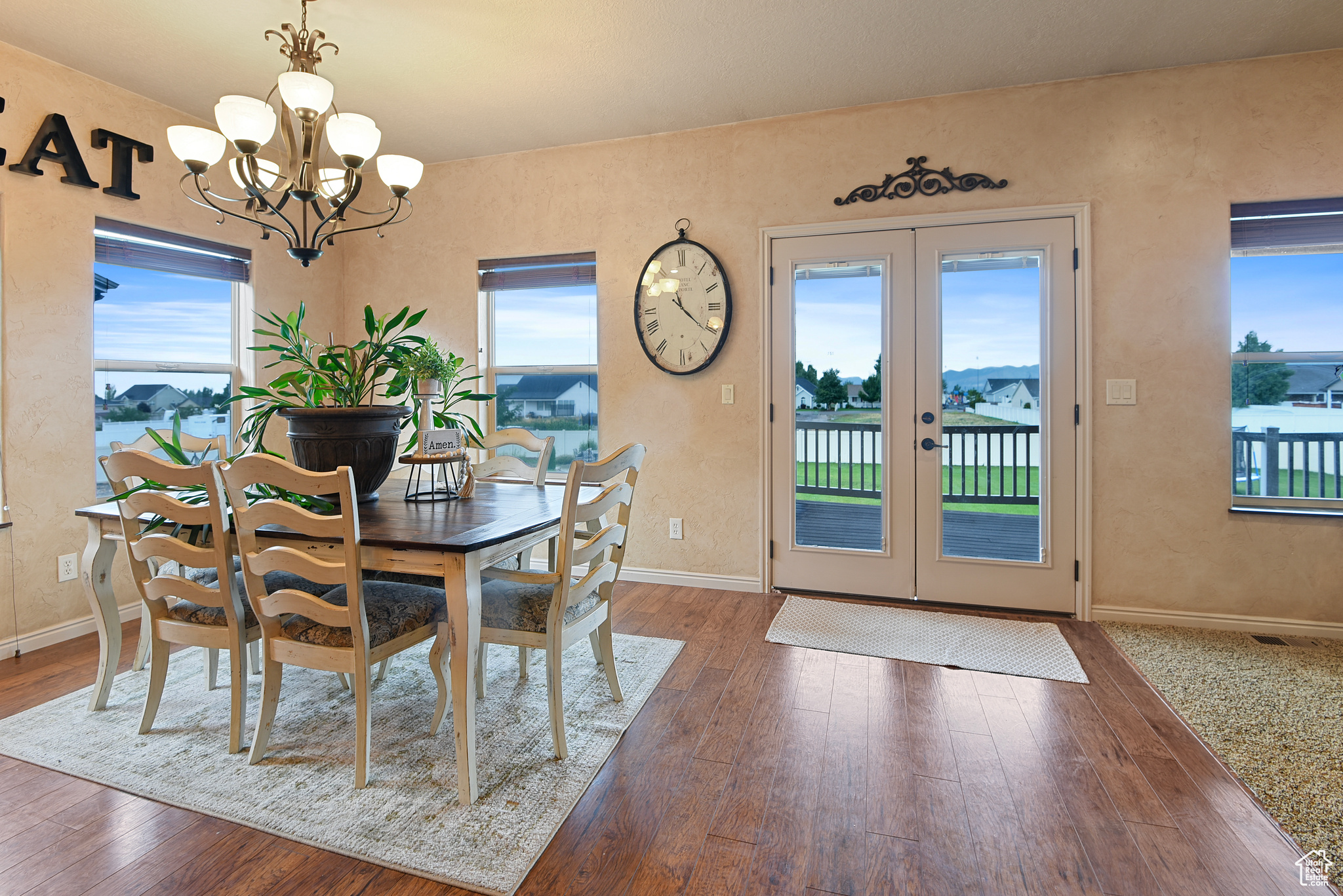 Dining area with dark hardwood / wood-style floors and plenty of natural light