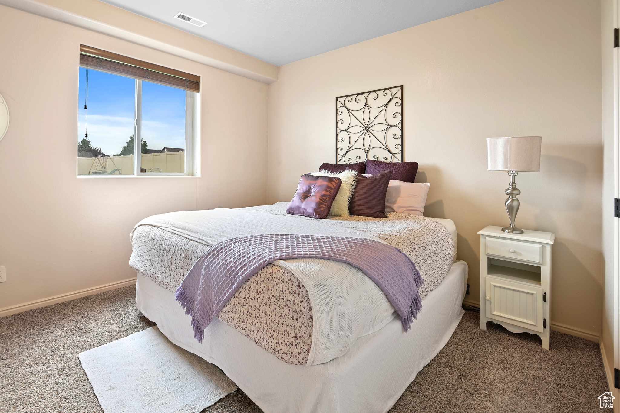 Bedroom featuring dark carpet