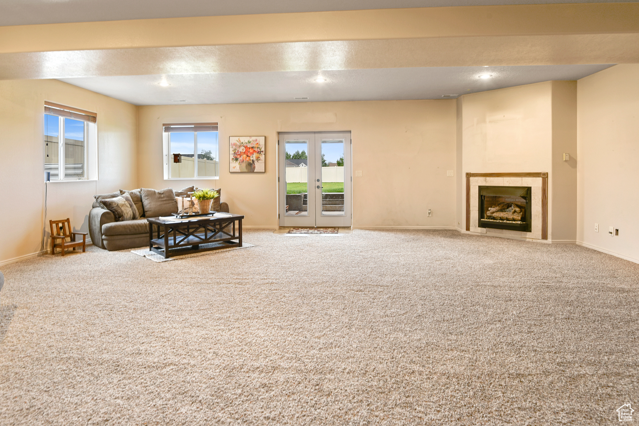 Living room featuring carpet and plenty of natural light