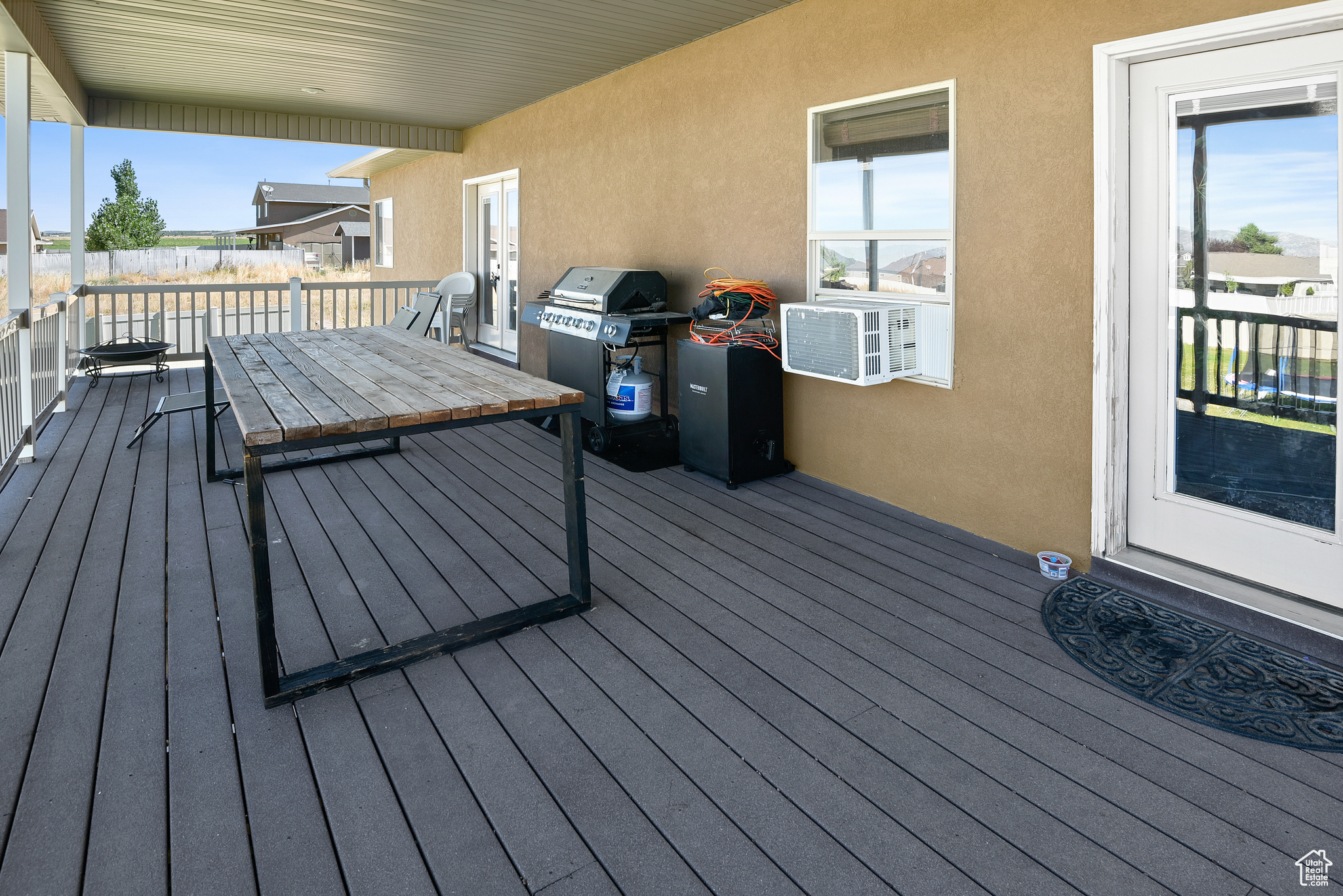 Deck with area for grilling and cooling unit