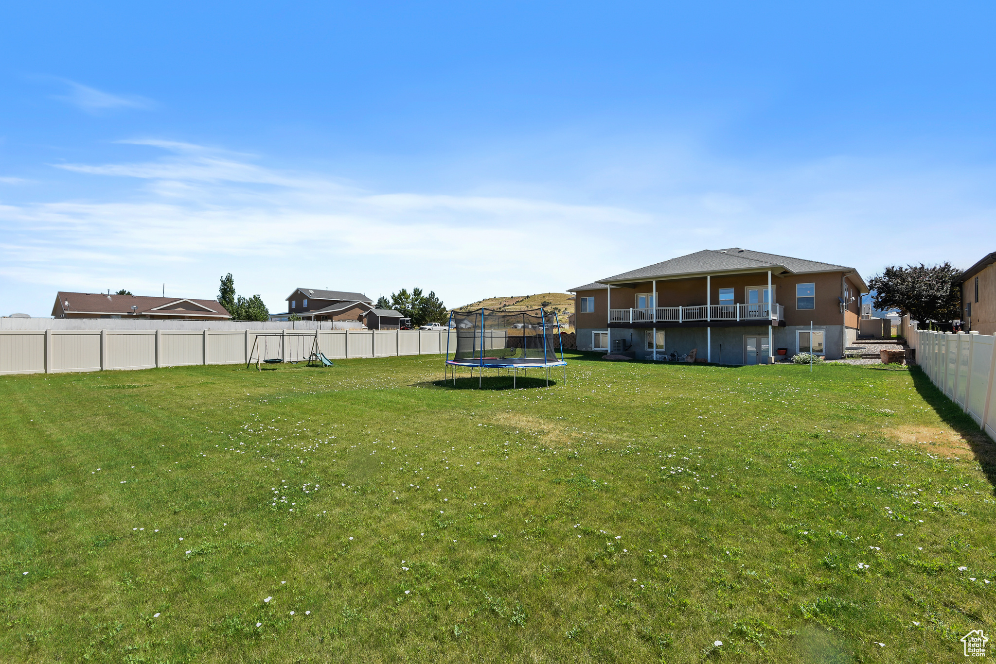 View of yard featuring a trampoline