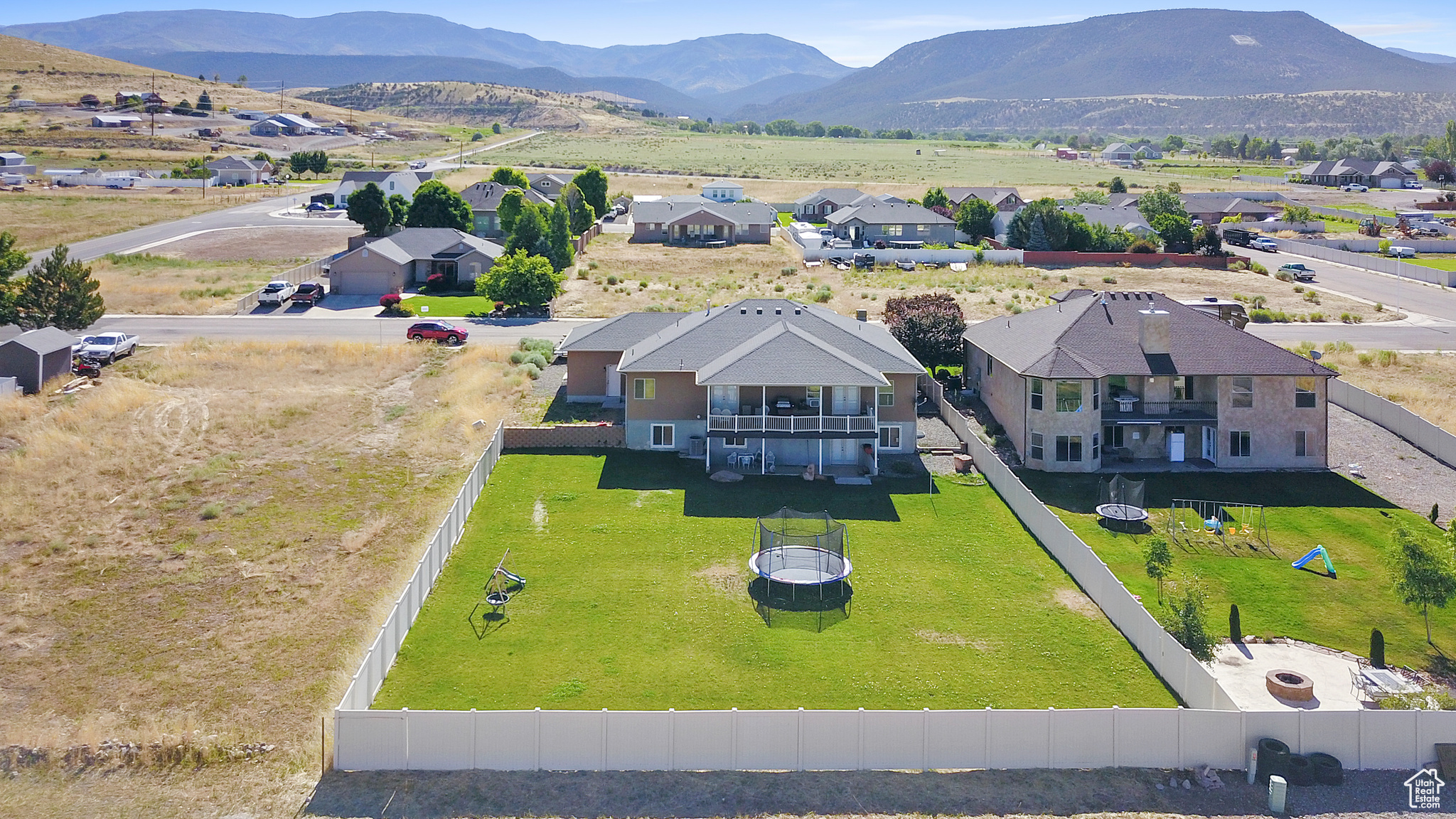 Birds eye view of property with a mountain view