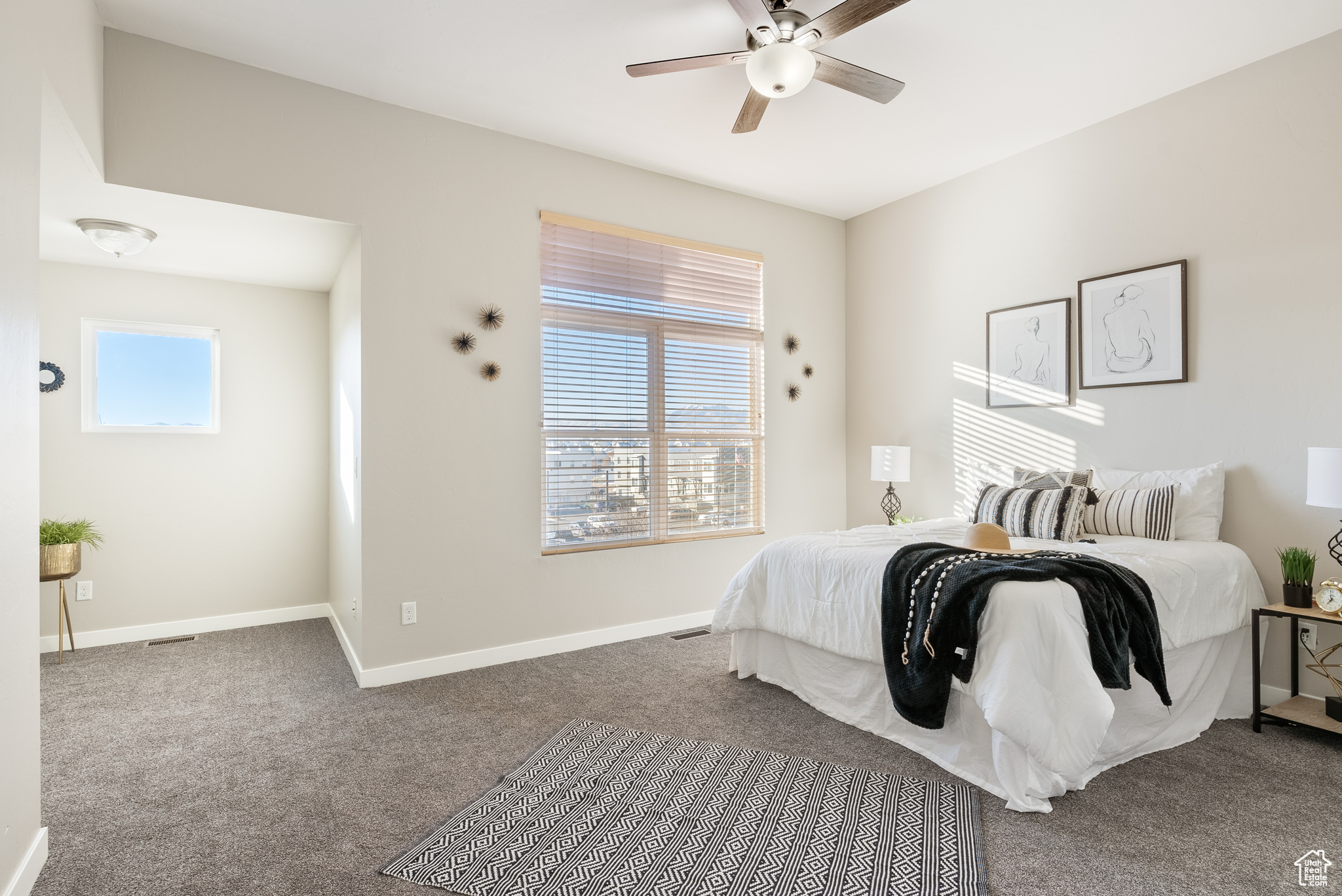 Bedroom featuring carpet and ceiling fan