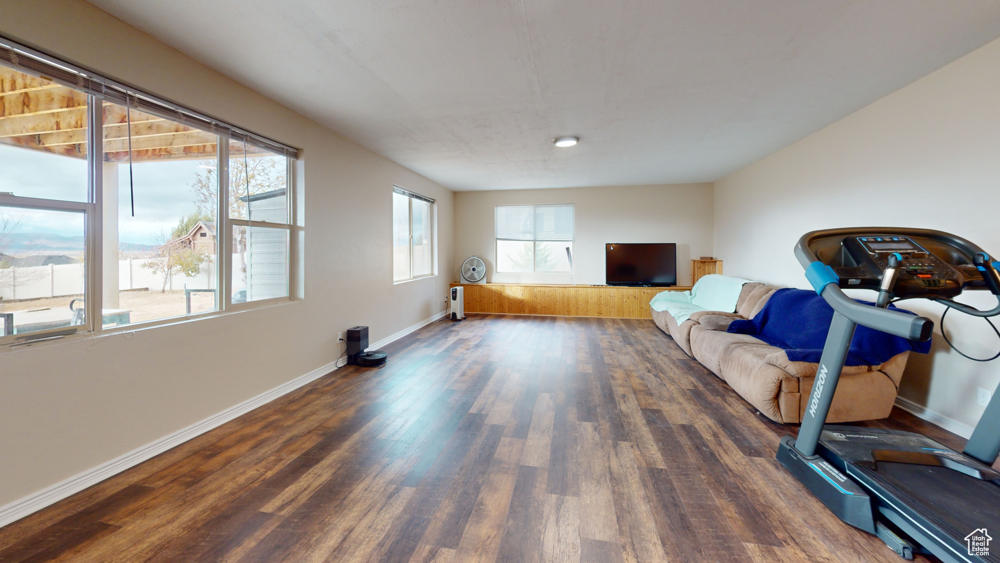 Exercise room featuring dark hardwood / wood-style flooring